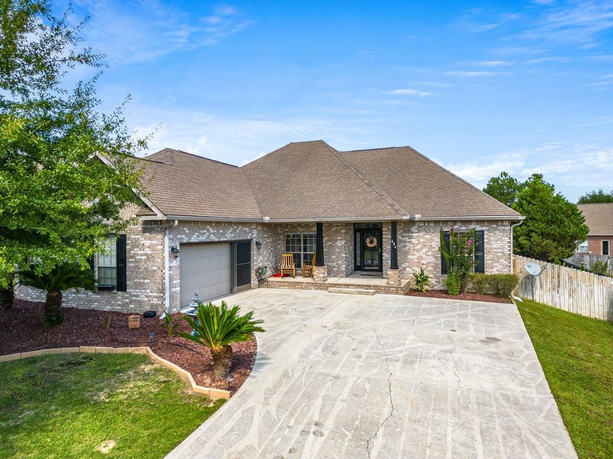 Located at desirable Rolling Ridge Estates in south Crestview is this three-bedroom home expanding over 2200 square feet featuring open-concept living with cathedral ceilings in the living room, trey ceilings in the large dining room and large windows throughout the main living areas for ample natural light. The kitchen has gorgeous new appliances, the two additional bedrooms have tall ceilings and are large enough to fit a queen bed and the primary bedroom is grand in size to include its ensuite with a separate tub and shower, double vanities and two walk-in closets. The back yard has a recently built deck with railing and pergola for entertaining or relaxing. Easy commuting puts this home just over 30 minutes to the shopping at Destin Commons. Consider this house for your next home.