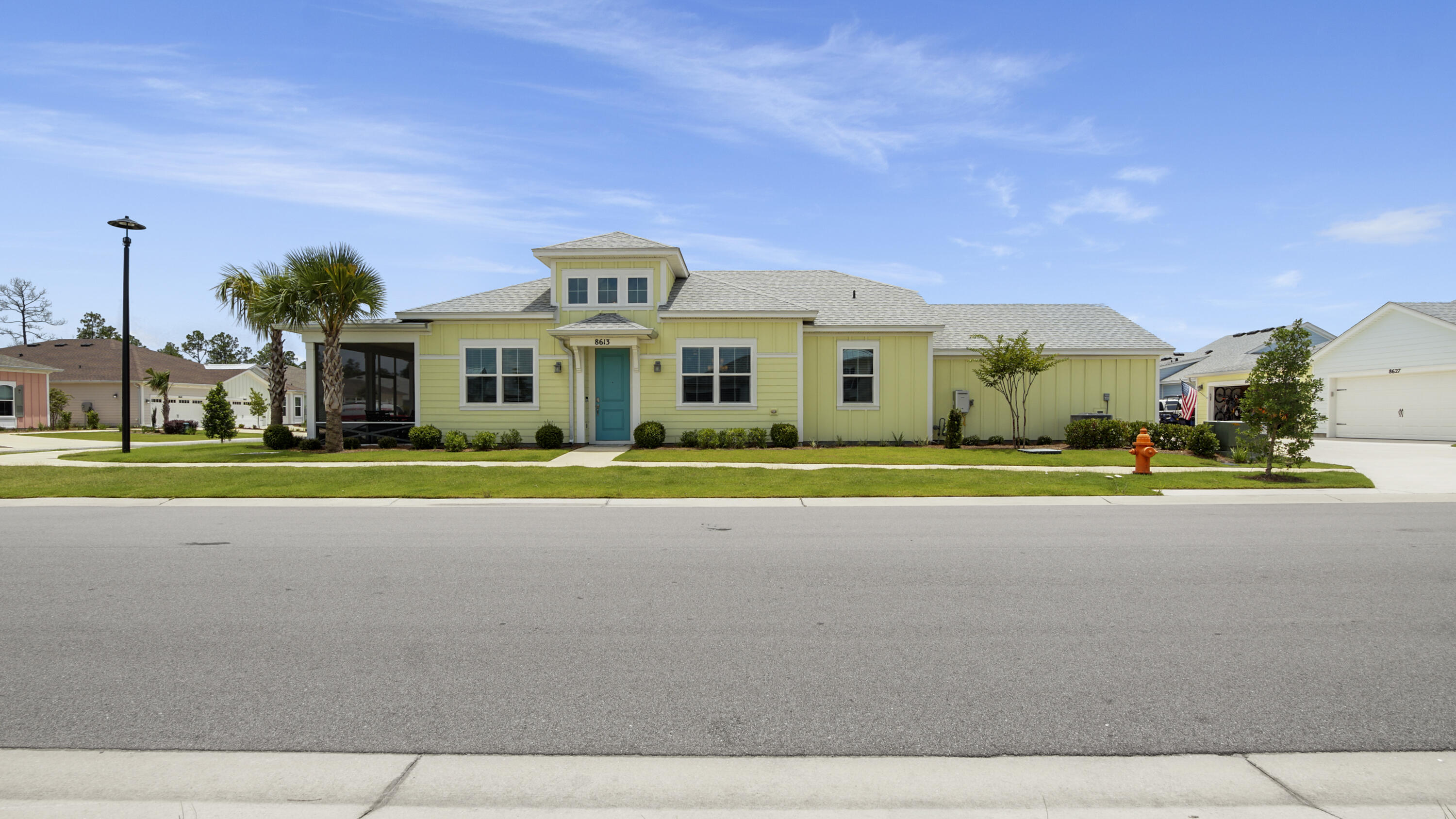 Welcome to this like-new Aloha floorplan located in Latitude Margaritaville, a gated 55+ community offering exceptional amenities and an active coastal lifestyle. This immaculate residence sits on a premium corner lot and features 2 bedrooms and 2 bathrooms, plus an additional flex-space perfect for an office, hobby room, or den. With over $75,000 in upgrades, this home showcases luxury vinyl plank flooring and recessed lighting throughout for a modern and cohesive feel. The kitchen is a chef's delight, featuring a spacious island, stainless steel appliances, a tiled backsplash, pantry, and beautiful lighted glass-front cabinetry with soft close doors. The bathrooms are equally impressive, with quartz countertops and showers that are tiled all the way up to the ceiling for a seamless, upscale look. Enjoy outdoor living year-round on the enclosed patio. The two-car garage is finished with epoxy flooring and includes a 20 amp outlet, keeping your car protected from the elements and your golf cart fully charged. Located within a vibrant community offering pools, fitness centers, restaurants, entertainment, and tennis or pickleball, this move-in ready home is perfect for enjoying everything Latitude Margaritaville has to offer.