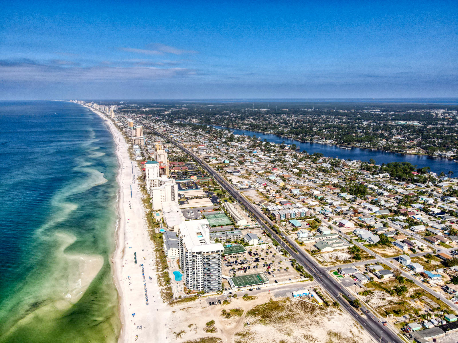 This spacious gulf front condo is almost 1400 square ft ! You will enjoy both sunset views from your living room and breathtaking views from the gulf front Master! Access your extra large balcony from both the Master and Livingroom. This spacious condo is currently a rental machine and being sold fully furnished, set up to sleep 8! You will find a separate laundry area, well equipped kitchen with beautiful granite counter tops. The master bath offers an extra long vanity with double sinks! Don't forget about the amenities such as a large pool (seasonally heated), hot tub, kiddie pool, expansive sundecks, lighted tennis courts ,shuffle board court, indoor racquetball court, exercise room and access the to World's Most beautiful beaches!