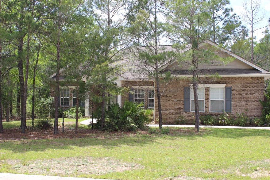 Former Parade of Homes Blue Ribbon winner home. Located just minutes from schools, shopping, restaurants, the post office and the library on a .62 privately wooded lot. This home features the large open concept area with split floor plan.Large spacious kitchen with beautiful granite, upgraded wood cabinets, stainless appliances, tile flooring, new carpeting, large wood plank flooring, tray ceiling in the formal dining room, wide upgraded crown moldings, beautiful architectural details, Glamour bath with separate shower, garden tub, raised ceilings, columns, french doors that open to large deck outside. There are winding roads, sidewalks, lamp posts, and beautiful trees in this neighborhood for your serenity.