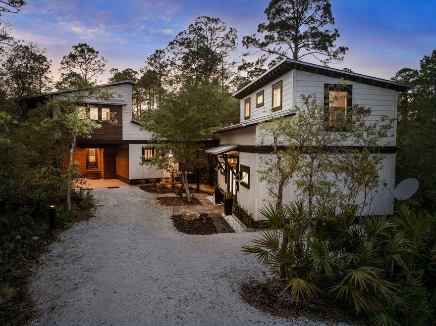 Exquisite Japandi-Style Retreat. Discover a harmonious blend of modern Scandinavian and Japanese design in this stunning home, completed in 2019. Located in a coastal area, this residence meets all current coastal building codes, ensuring both elegance and resilience. Enjoy peace of mind with high-quality, hurricane-rated windows and doors throughout the home, along with a standing seam metal roof for durability. The sewer system is city-supplied, and on-demand water heaters serve both the main house and guest house. The main house showcases 3/4-inch tongue and groove Ipe hardwood floors, custom-made walnut ply cabinets with hardwood trim, and top-of-the-line appliances, plumbing fixtures, and modern lighting fixtures. Heating is propane in the main house and electric in the guest house,