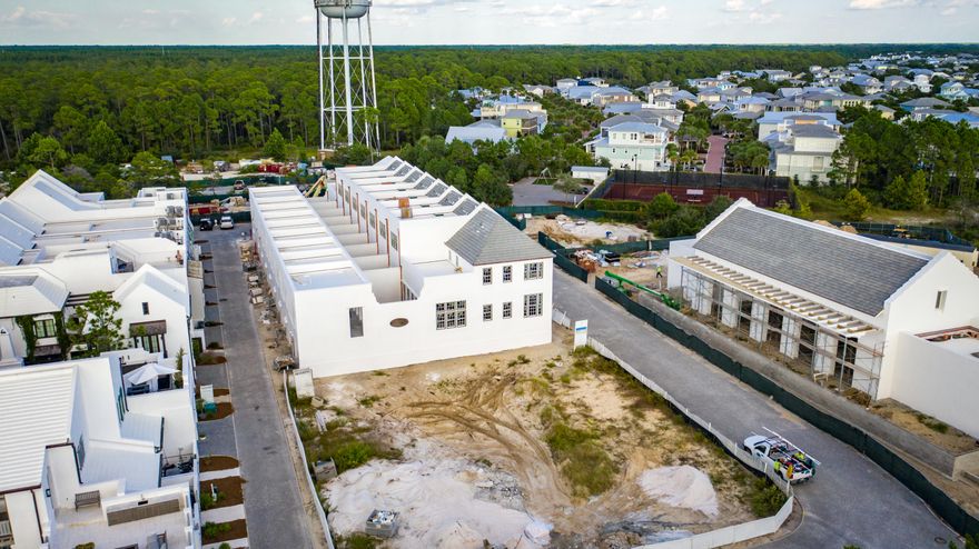 MUST BE A simultaneous close.Clermont Courts designed by Khoury Vogt Architects and overlooking the gracious new Alys Beach Fitness Center, reprises the success of Caliza Courts. Along with the Fitness Center, they will anchor a burgeoning new neighborhood around Arboleda Park, just to the east of Caliza Pool and the emerging Town Center. Raised stoop entries bordered by landscaped planters provide access to the entry and stair hall that ushers one into the main living area, elevated half a floor above grade. Spanning the width of the homesite, the great room has a 16-foot ceiling and 12-foot tall doors and windows that open to a central landscaped courtyard. Across the court, an open-air loggia looks out on the private garden and fronts a detached guest suite, both raised above