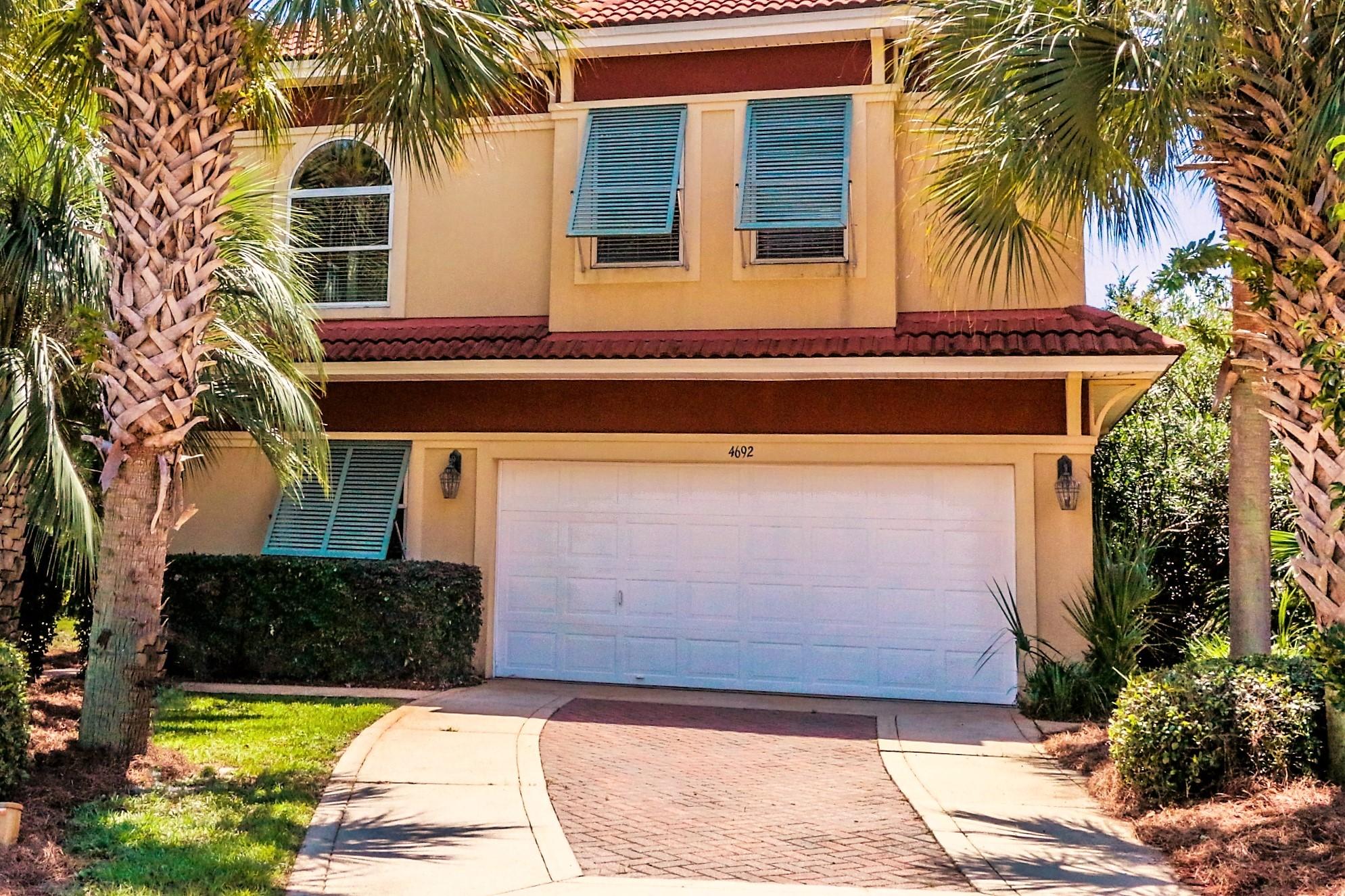 Price Reduction!!! Take a look at this wonderful Mediterranean home located in the gated community of Calusa Bay, Located close to the beach, features include hardwood flooring thru-out, large designer kitchen with plenty of room to entertain friends and family. Dining area will fit large table. Home is light and bright with lake views from several rooms, Upstairs includes 3 Bedrooms and loft. Master bath is huge with double vanity sink's,Jacuzzi tub and a walk-in shower. The loft will accommodate a sitting area, small office or play area. Interior is pre-wired for flat screen TV's.Community includes a private pool overlooking the lake and a walking trail connecting Regatta Bay. As you can see the large home offers something for everyone. Home is in X Flood Zone!