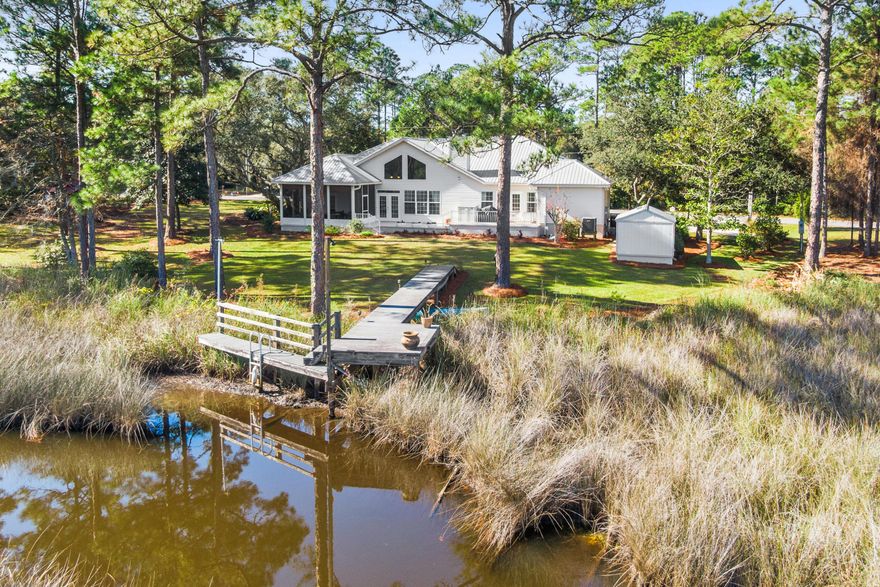 A refined waterfront estate on two lots spanning 325 feet, this exceptional 1.2-acre property is located within an intimate, HOA-protected bayfront enclave. The property features 230 feet of navigable waterfront on Gurley Creek, with unobstructed views across a federally protected estuary to Choctawhatchee Bay, preserving the natural setting for generations. The custom-designed residence, built in 2005 and held by the original owner, has been well maintained and thoughtfully updated. The home offers three bedrooms and two baths with comfortable, elegantly designed living spaces featuring scenic vistas through many large windows and French doors in every room. Additional highlights include a 40-year steel roof and an oversized garage. A rear covered screened porch provides a peaceful extension of the living area ideal for enjoying coastal breezes, water views, and quiet evenings overlooking the creek. A private, custom-built boat dock located on a natural slip provides direct access to 230 feet of navigable waterfront, allowing easy passage to Gurley Creek and onward to Choctawhatchee Bay for boating, paddleboarding, and fishing. Situated within a 31-home single-family bayfront community with very low annual HOA dues, this property blends privacy with long-term protection. Ideally located just three miles from the white-sand beaches of the Gulf of Mexico, as well as shopping, dining, and medical facilities. An elegant, well-kept waterfront retreat where scale, views, and location converge in a truly special coastal setting.

