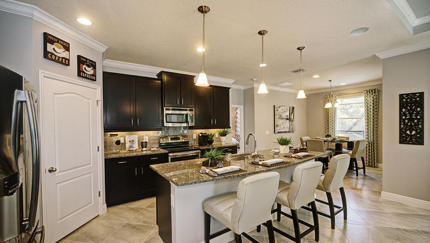 Our newest plan the Camden with a 3 car front entry garage. 4 bedrooms, 3.5 baths with mother in law suite or second master bedroom with living room. Gorgeous kitchen with large island, granite counter tops, corner pantry, stainless steel appliances, breakfast room and open to the Great Room. Formal dining room with trey ceiling. Master suite with garden tub, separate shower, dual vanity sinks and large walk in closet. 4th bedroom has it's own bathroom and living room for a second master suite or would work great for guests. 18 x 10 covered back porch. Photos will be of a similar Camden home. Keep in mind some of the features are not always available in our community.