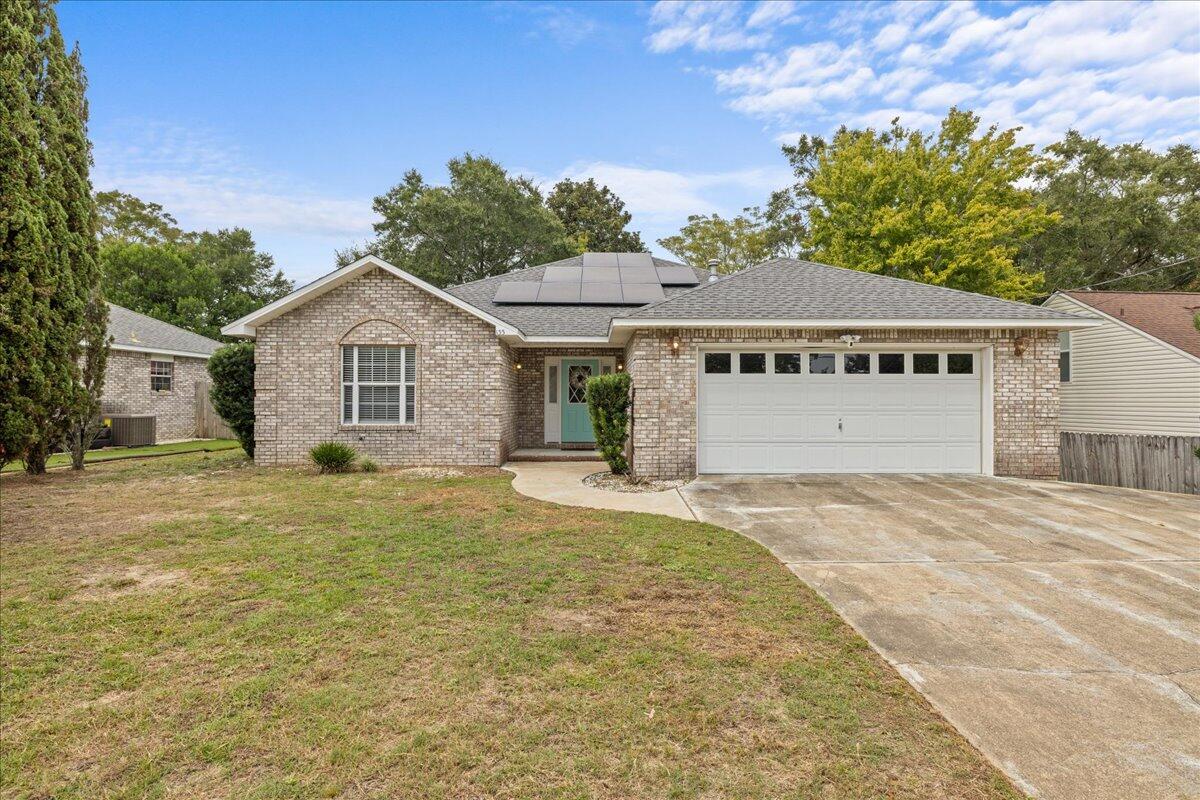 Welcome to this beautifully updated 3 bedroom, 2 bath home nestled in the heart of Valparaiso, just moments away from the East gate of Eglin AFB! Offering years of worry free living with recent major system updates- NEW HVAC (2023), Roof (2019) and Water Heater (2019) and Solar Panels (2020--TO BE PAID OFF AT CLOSING). LOW ELECTRIC BILL DUE TO SOLAR PANELS provides huge benefit to the buyer.This home features an open floor plan and hardwood flooring throughout. Living room has ample space for furniture and soaring cathedral ceiling.The UPGRADED kitchen features a breakfast bar for casual dining, offers granite countertops, warm wood cabinetry with soft close doors and drawers, modern Kenmore PRO stainless-steel stove and microwave and complementing dishwasher and SxS refrigerator. Spacious primary bedroom with en-suite bathroom featuring double vanity, relaxing tub, and separate showerSplit-bedroom floor plan with 2 additional bedrooms and a full bathroom.
Privacy-fenced backyard with updated deck. A 2-car attached garage completes this beautiful home.