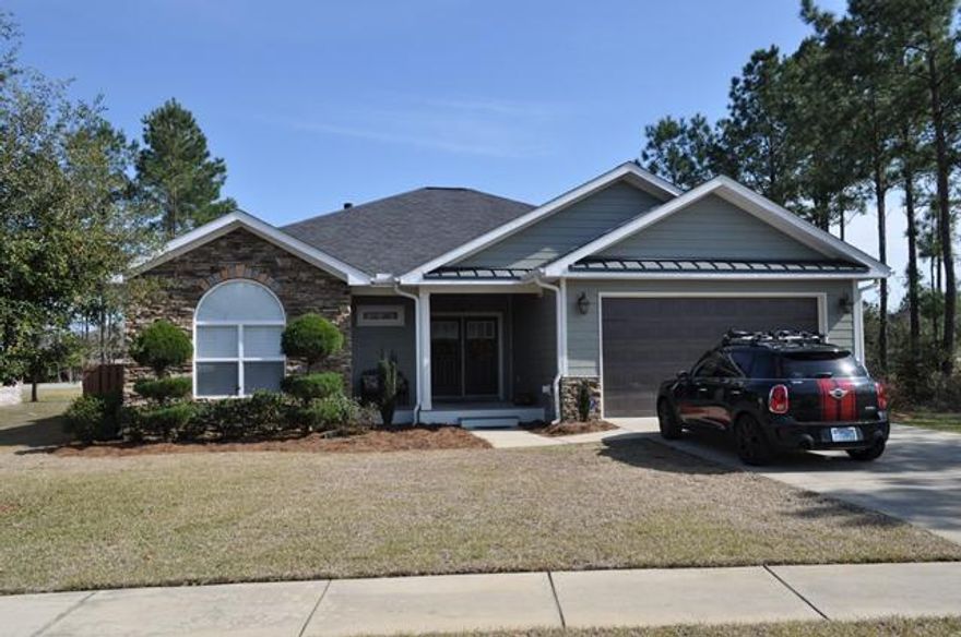 This custom built Craftsman boasts fine finishes few homes in Hammock Bay offer. Located in the Whispers neighborhood, this home is located on a cul de sac and situated on one of the many Hammock Bay Ponds. Interior space includes three bedrooms, two bathrooms, open living area with beautiful wood flooring, gas fireplace and Gourmet kitchen with granite countertops, wine refrigerator in the large kitchen island, gas cook-top and wall oven/Microwave, and custom cabinets and pulls. The exterior is reminiscent of the Southern craftsman style with large porches on the front and rear of home. A two car garage provides security and extra storage. Beautiful Lake views from the lush backyard living space. This home has had a ton of upgrades. Schedule your showing now, it won't last long!