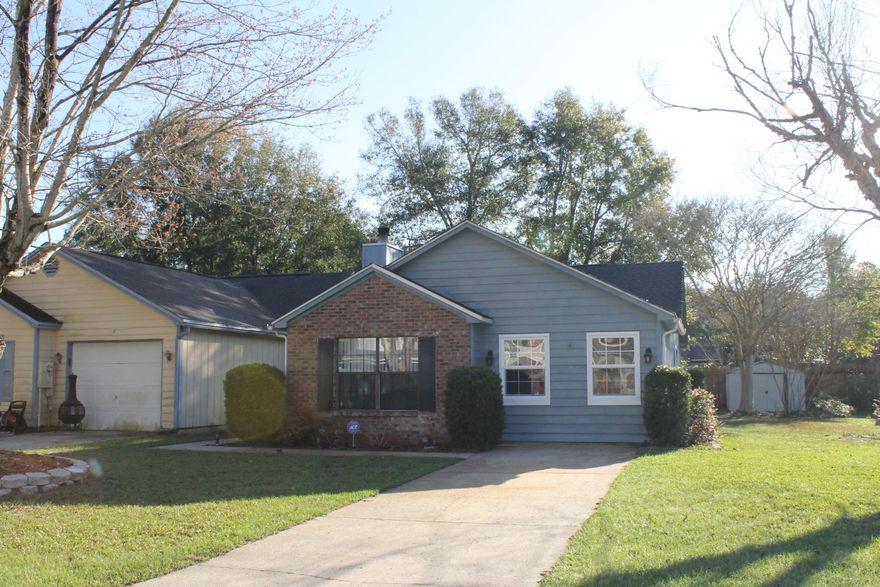 Located right at the entrance of the neighborhood, this home has a larger lot than most in the community. Roof and HVAC are approx 10 years old and water heater is about 8 years old. Laminate wood flooring installed in 2011 thoughout the living room and bedrooms. Tile floors in the entry, kitchen and baths. Beadboard on the ceiling in the kitchen, and wainscoting on the walls along with the painted cabinets and wood look counter bring the Farmhouse style into this home. Tall ceilings and wood beam adorn the living room with a beautiful brick wood burning fireplace. The master bath has been updated with tile shower, tile surround on the walls, and pedestal sink. Nice large laundry room. Incredible deck with pergola off the back of the home. Sprinkler system being sold as-is