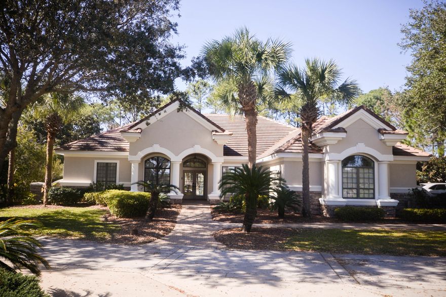 LOCATION! LOCATION! LOCATION!This was a model home, with with a distinctive layout. The pool is visible through floor to ceiling windows in the living room, den and kitchen. The home is ideal for entertaining with large living room, den and pool patio area. A gas log fireplace in the living room adds charm and warmth to the living room. The pool table in the Billiard Room conveys. A screened tunnel leads from the guest bedroom to the outdoor Tiki Room for cats, is accessible through a screened tunnel. Engineering work is being completed for a pool enclosure with stucco columns.