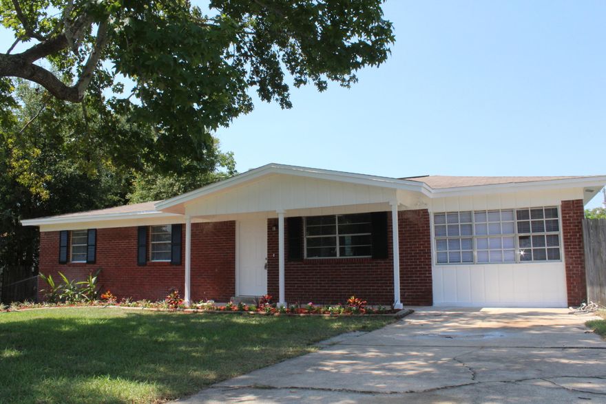 Totally renovated 4 bedroom 2 bath home with 1296 sq ft in the desirable Shalimar location! The home has been newly painted on the interior and exterior. The home sits on a larger corner lot and features a beautiful brick veneer on the front. The kitchen has been updated with granite counter tops, tiled back splash, and stainless and black appliances (2015). The flooring in the kitchen is newly tiled. The master bathroom has a newly tiled walk-in shower with decorative glass tile accents. The vanities, mirrors and light fixtures in the bathrooms have been replaced. All bedrooms and living room have new carpet and ceiling fans. The home features a 10x12 screened in patio and a 10x12 under roof storage closet.