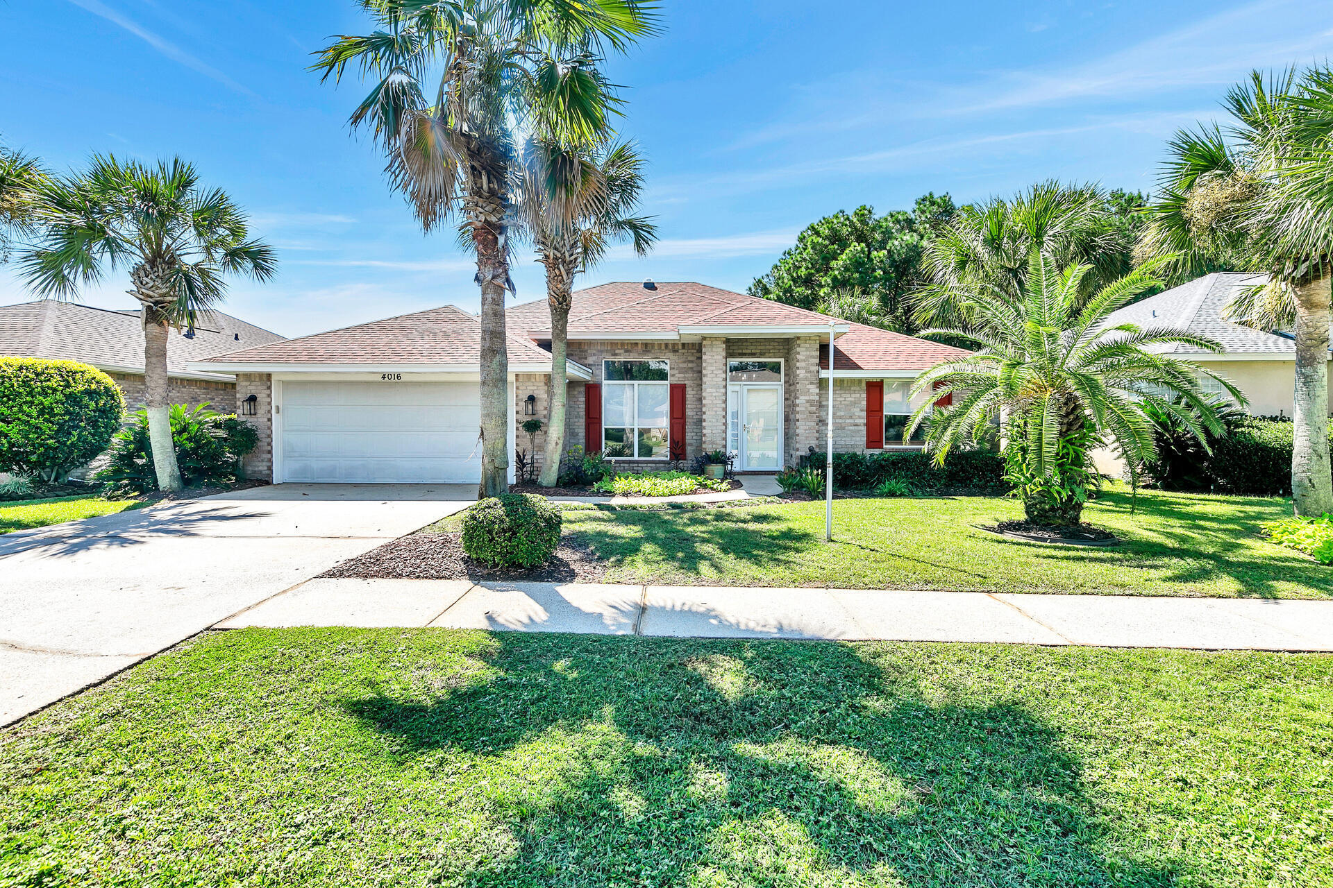 Set in a desirable lakeside neighborhood, this home offers a well-designed and spacious lay-out, perfect for both relaxation and entertainment. The split floor plan provides privacy for the master bedroom, while the remodeled kitchen serves as a central hub with its modern quartz countertops, stainless appliances, and ample pantry space. With an open connection to the living area, you can enjoy the peaceful lake views and natural light pouring in from the vaulted ceilings and skylight domes. The gas fireplace adds warmth in the colder months, complementing the serene setting. The formal dining room, with its high ceilings and elegant columns, creates a distinguished space for gatherings. The master suite is a retreat with its large bathroom featuring quartz countertops, a walk-in shower, and an impressive closet. Practical features like the spacious laundry room, 2-car garage, and enclosed patio add to the home's appeal. 