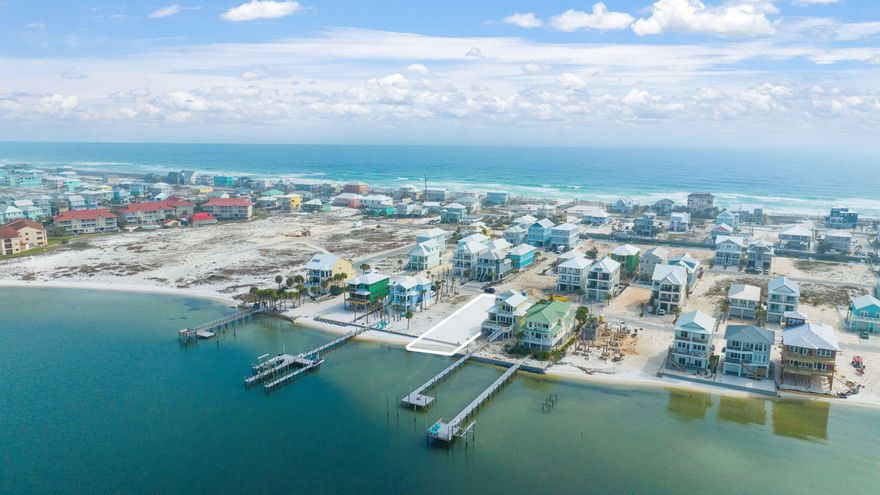 Welcome to your own piece of paradise at Navarre Beach! This incredible waterfront lot boasts stunning panoramic views of the Santa Rosa Sound and provides the perfect setting for building your dream coastal home or vacation property. Navarre Beach is known for its crystal-clear, turquoise waters and sugar-white sand beaches, offering a truly unparalleled coastal living experience. With direct access to the water and a private beach, you'll have endless opportunities for water activities and outdoor entertainment. The Santa Rosa Sound is a beautiful and serene body of water that is perfect for swimming, kayaking, paddleboarding, and other water sports. It is also home to an abundance of marine life, making it a popular spot for fishing and snorkeling. This highly desirable location offers all the perks of coastal living with the convenience of being just minutes from restaurants, shopping, and local attractions. Plus, with a new sea wall installed in 2022 and a survey available, the lot has been backfilled with sand and a geocon report has been completed, making it a prime investment opportunity for your forever home, vacation home, or vacation rental. Don't wait to make this stunning property yours!