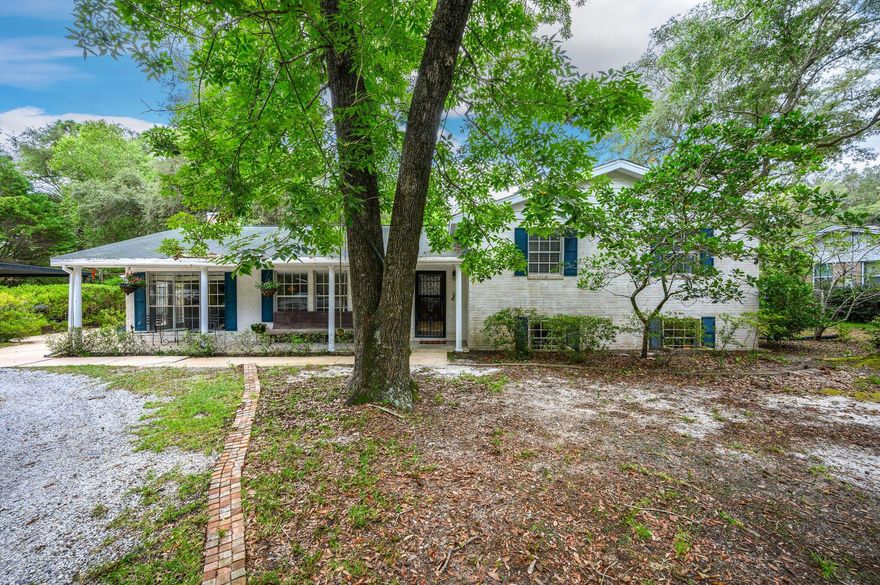 Looking to be in prime location of Valparaiso? Look no further then this estate style home situated on a spectacular lot! Plenty of room for multiple garages, play areas, gardens, and more. View the bay waters from the front yard! All located just mins from the Eglin gate and local schools. The home is a stately 3 bedroom, with an updated kitchen and large living areas. The main living area is located off the entry and is overlooked by the kitchen. The additional living space is located downstairs and has easy access to the backyard. Perfect home to make your dream property and style as desired. This sprawling home is sure to check the boxes, great location, great price, and great property!