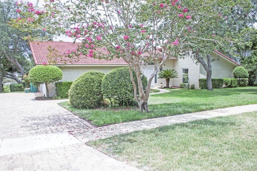 Prestigious brick home in Indian Bayou with a deep water new dock and 8000 lb lift installed 2002. Nicely landscaped yard with enough room for a large pool and outdoor kitchen. New ''real'' hardwood floors in living/dining and hallways, large atrium with windows for natural light. Lots of windows on the back of the home, sunroom and master bedroom. Large master suite with fireplace and private patio, 2 closets in master bath and dbl vanities, separate shower and tub. Two extra large bedrooms. There is a formal dining room, wet bar with ice maker and granite counter tops. Seller just put a new geothermal system 2015. New windows 2007/2008 all are hurricane proof or have pegs and fabric shields. Over $14,000 in landscaping. NO LOMA LETTER NEEDED and flood zone X NEW AC/HEATER MAY 2015