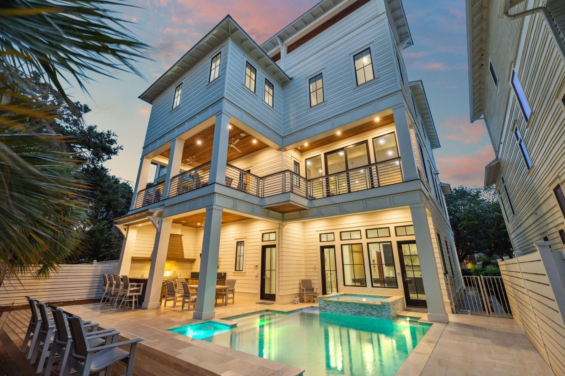 Welcome to 57 Azalea Street, a beautiful beach retreat located in Old Seagrove. This home offers luxury coastal living with two public beach accesses just 250 steps away. The home features 8 bedrooms and 8.5 bathrooms, plus a private resort-style pool, outdoor kitchen, dining area, bar space, rooftop deck with Gulf views, game room, and an elevator. The first level features a family entertainment area with a large game room. It also includes a guest bedroom with an ensuite bathroom and a bunk room with three Queen-over-Queen bunks and a shared shower. On the second level, the open living area combines elegance and comfort. The gourmet kitchen has high-end stainless steel appliances, a large marble-topped island, and custom cabinets. Step outside to the spacious terrace and take in the views of the resort-style pool and hot tub, which look beautiful at any time of day. In the primary suite, a king-sized bed welcomes you to relax. The ensuite bathroom feels like a spa, featuring a deep soaking tub, a large walk-in shower, and double vanities. There are also Twin-over-Twin bunk beds for extra guests. The third level focuses on guest comfort and privacy. It includes an additional primary suite with a private bathroom that has a shower and soaking tub, three guest suites with private bathrooms, and a two-twin bedroom with a private bathroom. End your day by enjoying a cocktail on your private rooftop deck as you watch the stunning sunset paint the sky with gold and pink colors. This luxury beach home represents elegance, comfort, and modern style. Experience the best of coastal living, where every detail is carefully designed.