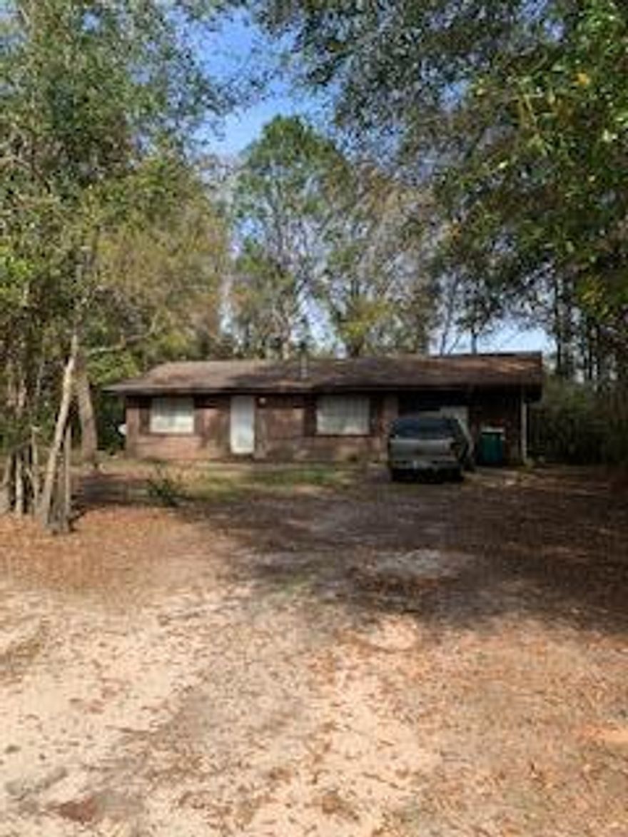 Brick home on .56 acre.  Investors dream.  Property is sold as is.   Buyer to verify all information important to buyer including but not limited to square footage, room size, lot size, zoning, etc.