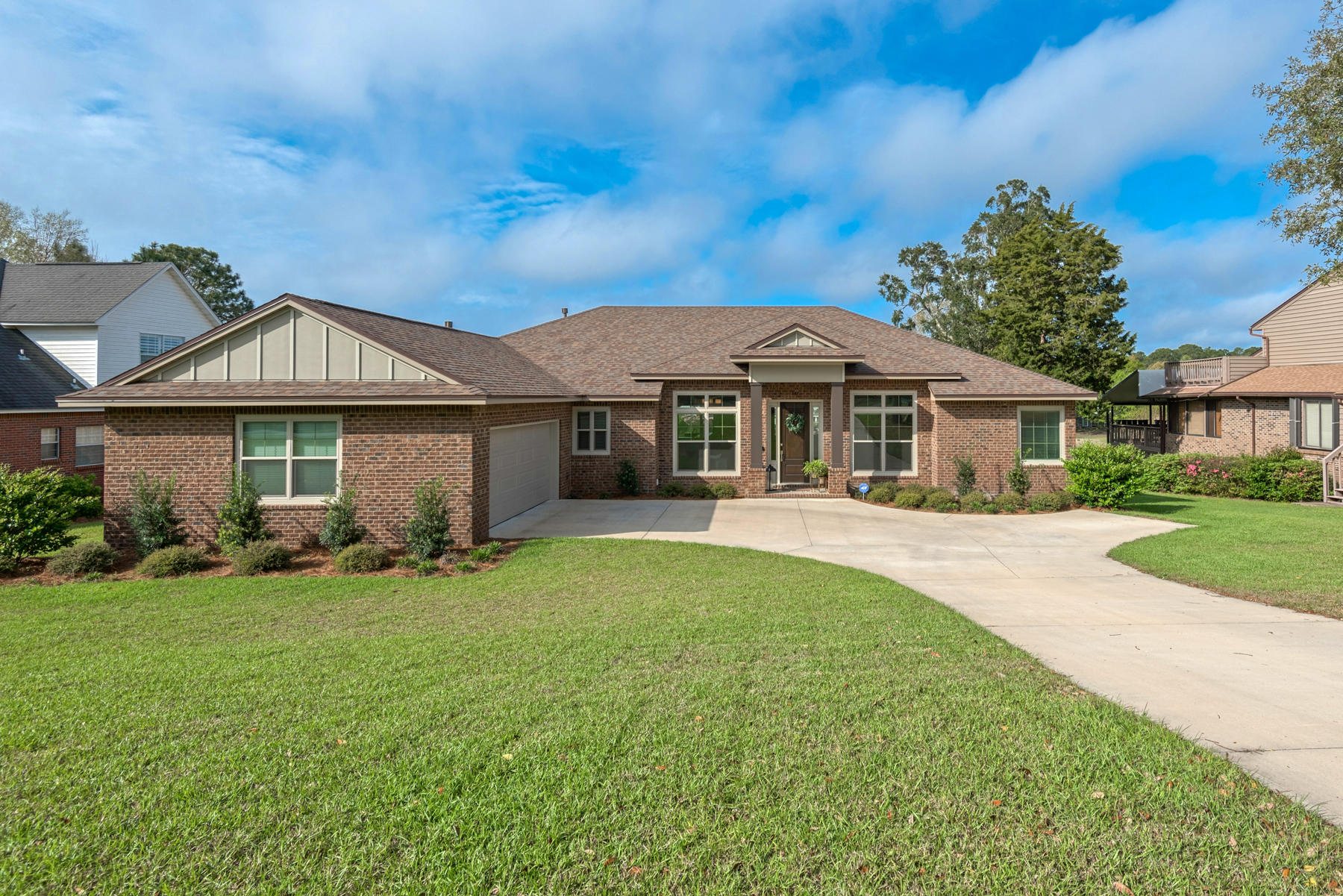 The Best of Bluewater Bay!! This gorgeous 4 bedroom (with additional office), 3 full bathroom home is nestled on a large lot and includes all the desires of Bluewater Bay without the demanding needs of a HOA! This beautiful, turnkey home is less than 2 years old and was built with every need in mind! The spectacular floor plan boasts a myriad of additional features including a separate laundry room, a wide hallway with the drop zone mud room space from the side entry garage as well as a large granite kitchen island. Out back, you'll find a hardy made back patio deck constructed with long-lasting Trex Deck material enabling beautiful views of the picturesque lake behind the home - a wonderful viewing spot to enjoy our beautiful NW Florida sunsets! A quick walk through of the home will