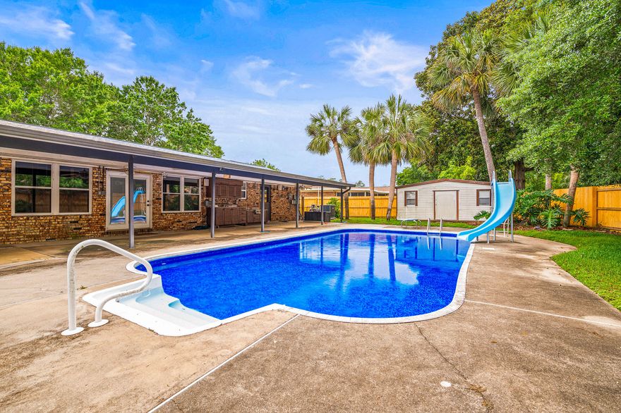 This impressive 4 bedroom 2 bath Kenwood brick home has been previously updated with a new 2025 wooden fence, 2025 refrigerator 2024 shingle roof, 2024 solar panels, 2024 27mm vinyl pool liner, new within 3 years a whole house Generac generator with Generac transfer switch, updated copper wiring, newer water heater, energy efficient 3 speed pool pump, gas logs for the interior fireplace, newer AC system, updated flooring with no carpet. The massive kitchen has solid wood cabinets, with granite counter tops throughout. The location is on a very quiet dead-end road for low traffic noise along with the safety for your kids playing in the yard. In addition to all of the this, there is covered boat/RV parking and an outdoor kitchen, plus a large storage shed for your tools/pool toys.