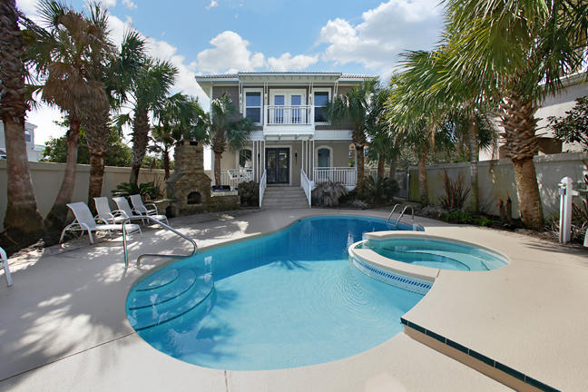 Phenomenal, completely renovated 3-story Gulf front home with pool & guest home in the exclusive gated community of Seclusion Dunes. The home is nestled on an oversized lot bordering award-winning Deer Lake State Park, making this a beach lovers dream come true! Drive up to the architecturally stunning 2-car carport with all new brick paver driveway and an abundance of parking space to easily fit five to six cars. Lush landscaping and palm trees surround the home with direct access to the beach to continue the feeling of your own hidden paradise. The private pool area features a unique stone fireplace, secluded pool & hot tub, and sun deck. Extended grass area on the Gulf side of the home is perfect for the kids and pets to play! This 5,000 sq. ft. home has been totally remodeled