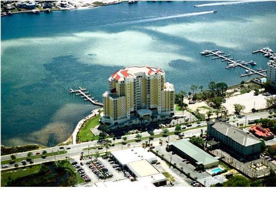 Beautifull END UNIT ON A 16 story building on the water. GORGEOUS WATERFRONT and SUNSET VIEWS AS WELL AS THE SOUND, AND THE GULF!!! MEDIA ROOM, ASSOCIATION ROOM to host your festivities and receptions, fully equipped FITNESS CENTER, and a GUEST ROOM when needed for extra guests. The first 2 levels are for the parking garage, once you drive inside you are protected from the weather, come rain or shine. This unit provides 2 Garage spaces. Top of the line Kitchen Cabinets-Thomasville, Granite countertops, crown molding, Trey Ceilings, and the Master bedroom has glass doors that allow you to access your balcony as well as enjoy the beautiful view. Master Bath has his/hers vanities, whirlpool tub, a private water closet. COMES WITH BOATSLIP AND 2 STORAGE UNITS