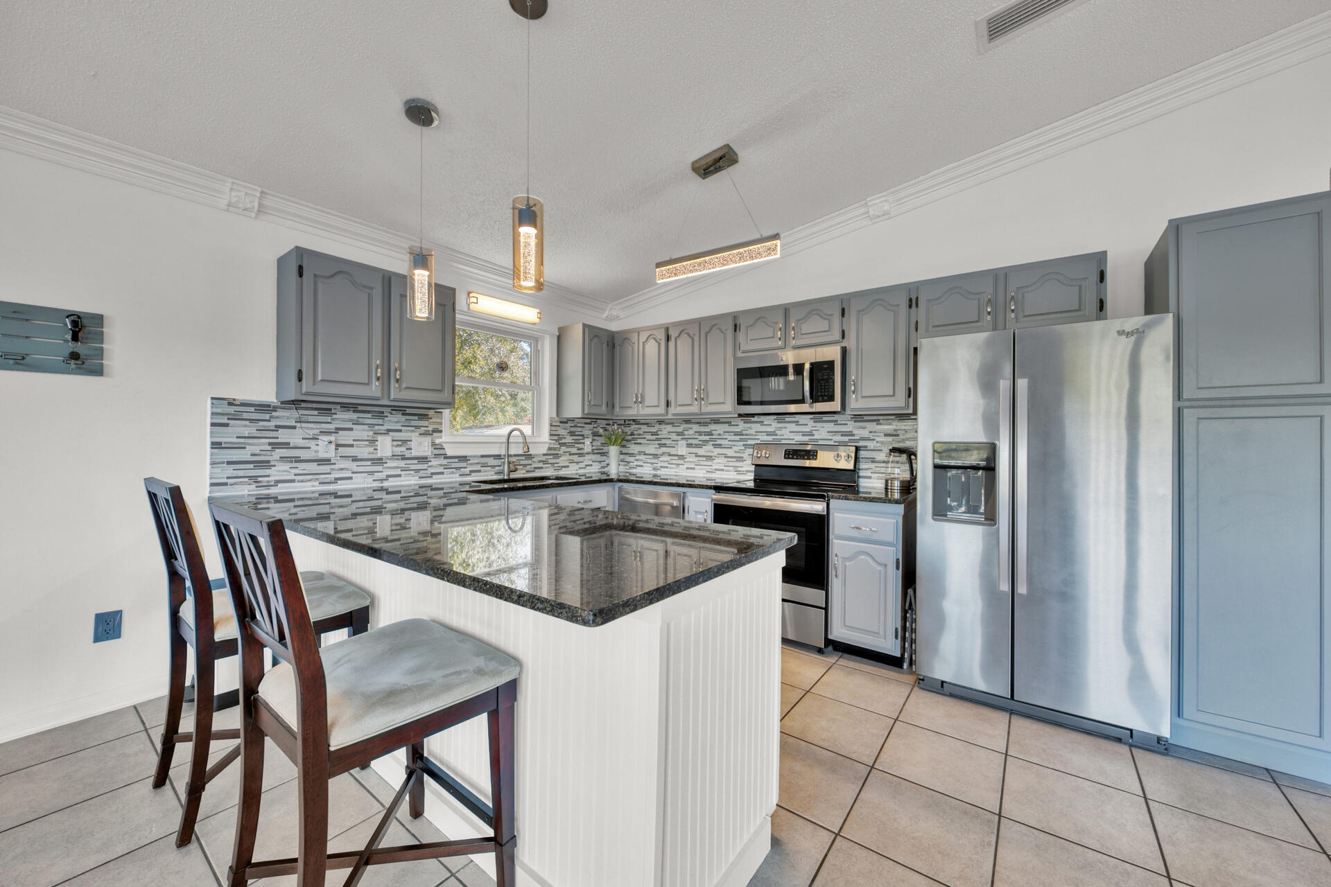Multiple offers received. Highest and best due by 1/20/2022 at 7pm. Welcome Home! This completely remodeled Panama City Beach home is one your friends, family and vacationing guests will enjoy for a lifetime. Soak in endless sunrises from your oversized sundeck or relax the day/night away in your Private pool Oasis! Located directly across the street from Lake Powell and a few minutes away from the Panama City Beaches. The newly remodeled kitchen boasts a custom tile backsplash, endless granite countertops, stainless steel appliances + so much more! Your master bedroom ensuite is oversized and features a stunning custom master bathroom that will leave NOTHING to be desired! This is one you will NOT want to let slip through your fingers! the perfect vacation rental, 2nd home.