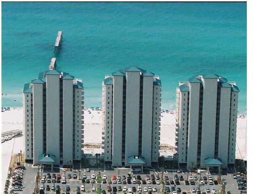 Gulf front condo with balcony from living room and master bedroom. 9 ft. ceilings. Bonus room that has bunk beds fort eh 3rd bedroom. Hall bath for bedroom 2 and bonus room. Large kitchen with bar and fully equipped. Full laundry room with closet. Unit comes fully furnished.