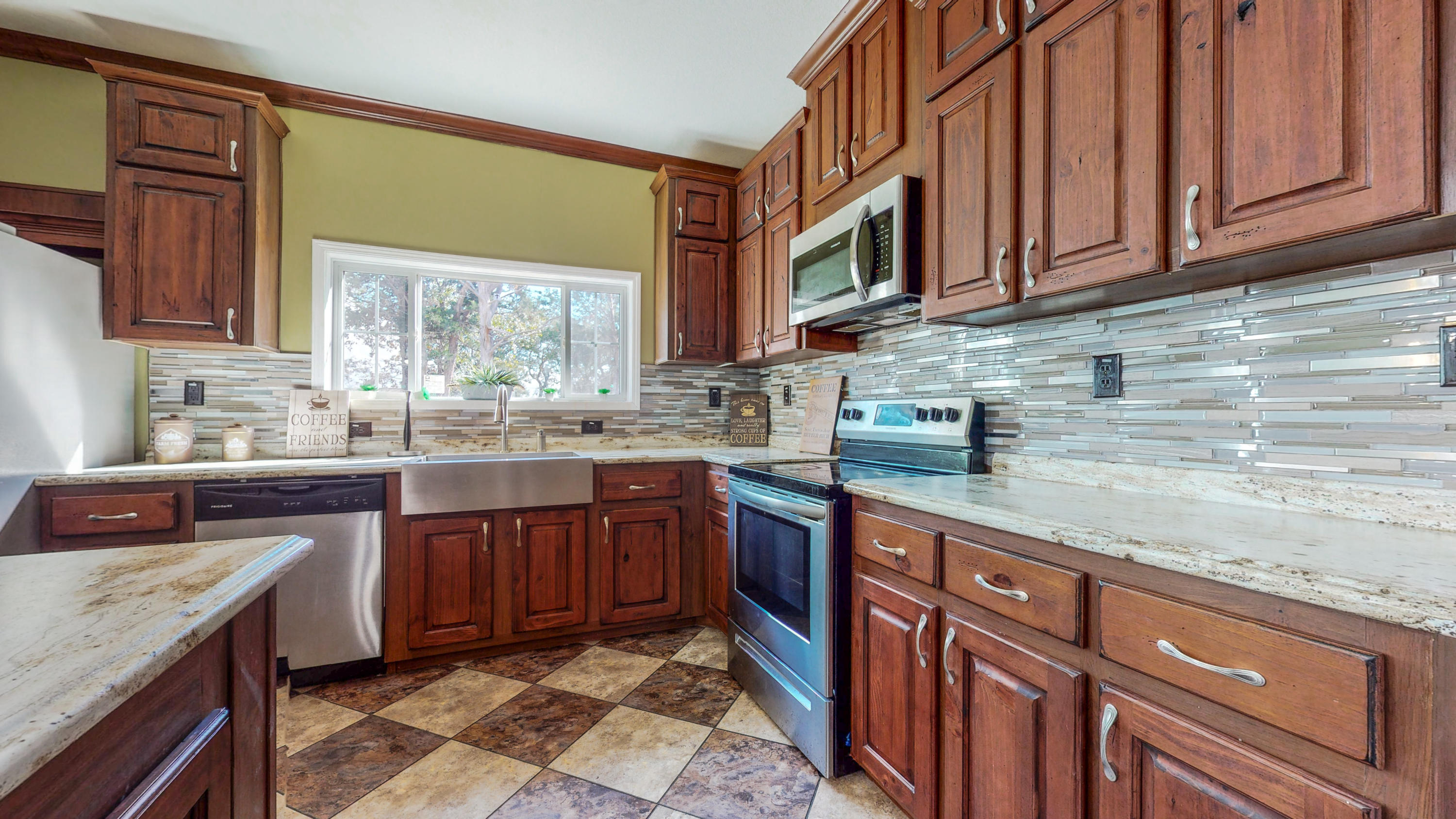 ENJOY CHOCTAWHATCHEE BAY VIEWS!! Fabulous 4Bed/2bath 2019 mobile home on a partially fenced gorgeous 1/2 acre property located in a prime location (Choctaw Beach area) between Freeport and Niceville. Home features a very spacious split-bedroom floorplan with both a large living room and a separate family room each with built-in cabinetry/bookcases. The kitchen is loaded with lots of beautiful cabinetry, stainless steel appliances and has a big island for gathering the family around. From the Kitchen and dining area or by stepping out onto the huge back yard, one can enjoy the spectacular views of the Bay. The large master bedroom has a good size walk in closet with built-in cabinetry and a huge master bathroom, which includes a garden style tub, separate tile shower and double vanity area.