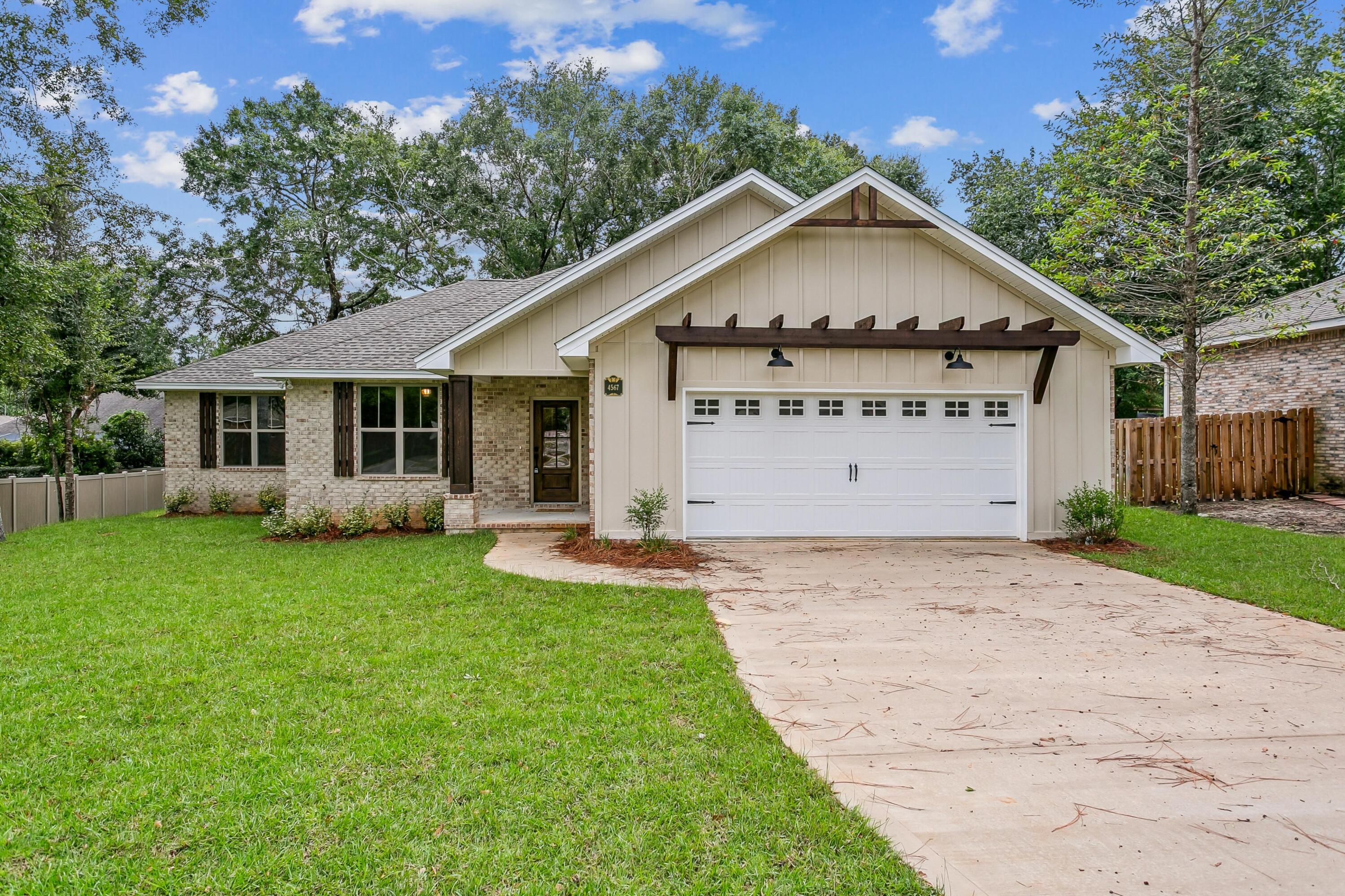 KG II Development semi-custom home in the exquisite Juniper Creek neighborhood. This open floor plan home includes four bedrooms, (one-bedroom doubles as an office) with three baths. Master bath includes separate shower with seat, garden tub, huge walk-in closet, comfort height commode, and double vanity. LVP flooring throughout most of the house. Kitchen sports a large island with Kohler sink, wet bar with ice maker and beverage cooler and a walk-in pantry. Huge back porch is plumbed for future outside kitchen and wired for hot tub. Jack and Jill bathroom between two large spare bedrooms are wonderful for kids or guests. The third bath shows off a tile shower. Laundry room has plenty of space for any size family's needs. Large garage accommodates toys with extra garage door.