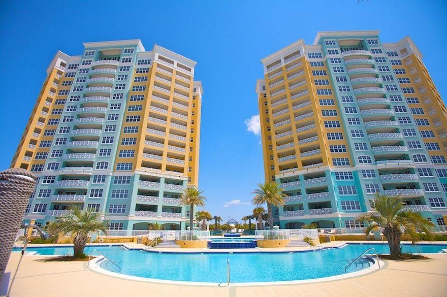 SHORT SALE! En Soleil is an upscale condo with spectacular views and exceptional amenities. This 11th floor unit has 2 Master bedrooms,a large guest bedroom, 3 full baths and 4th bunk room. the Views (views galore!) 2316 sq. ft. of living space with tile throughout. Another bonus is the 500 sq.ft balcony overlooking the ocean. The balcony offers ample outside living space, an outside kitchen that includes ceramic tile counter tops, a gas grill and electrical outlets so you can blend up your favorite tropical cocktail right outside while watching the sunset. Great Rental Unit with fabulous rental history. This is a must see!!!