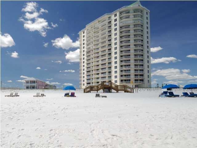 Arriving at the portico grand entrance of Belle Mer, you'll realize this is The Premier condominium on Navarre Beach! The building is angled to view the entire west portion of the island, allowing you to enjoy the most spectacular sunsets! What better place than on the 15th floor!! This unit is beautifully furnished and decorated. Floor to ceiling windows and sliders capture the amazing view. Features: granite counters, tile throughout, Stainless Steel Appliances, Wine cooler, Wet Bar, Tile Shower, Upgraded fixtures, en suite bathrooms and walk-in closets in each bedroom, and 9 ft. ceilings. The complex features: a heated pool, hot tub, travertine tiled sun deck, a community room, an exercise room and tennis courts. Covered Parking available, Exterior Storage, Ground level.
