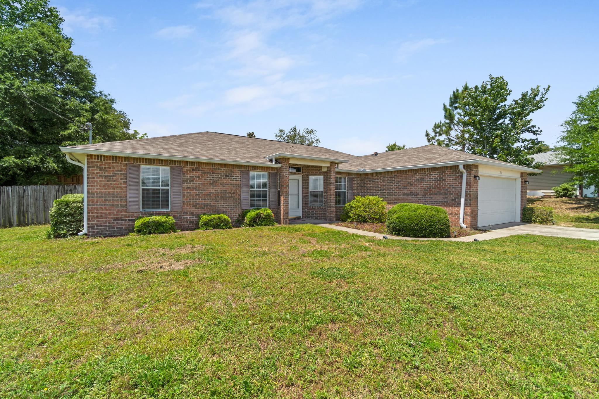 Welcome home to your new South Crestview house! This property sits just off of PJ Adams and is 25 minutes to Eglin and 15 Minutes to Duke Field. The Owners have meticulously maintained this along with several updates and features around the home. As you walk in you will be met with new flooring and repainted walls. Several lights around the home including the hallway and master bath have been fitted with LED recessed lights on rocker switches. The kitchen is fitted with a newly purchased Frigidaire refrigerator, white corain countertops, and dark cherry wood cabinets. Relax in the master baths big garden tub before picking out clothes from one of the two walk in closets! Enjoy the fenced in back yard while you hangout under the homes gazebo that is staying! Don't wait!