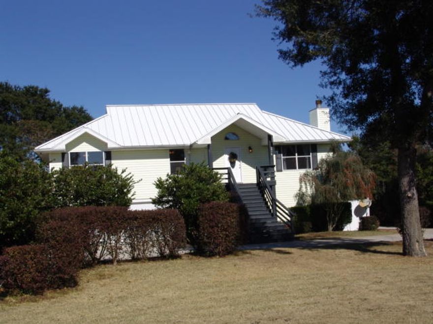 * ALL New Remodeled * Beautiful WATERFRONT Home directly on the East River, with beautiful Oak Trees, Circle Drive, 2 Screened Porches, over-sized 2 Car Garage. ''High and dry'' from the street to the water's edge! High end STAND 'N SEAM Architectural Metal Roof with NO exposed screws. 2 separate living Areas.. Immaculate 4 bedroom 3 bath home with brand new Kitchen Cabinets, GRANITE Counter Tops, New hard wood flooring, Brand New Stainless Steel Appliances all with an island and a view of the water. New Cabinets and Granite Counter tops in all baths, All new interior paint, All New Lights and fans, New Faucets, New 18 Tile in the Baths and Laundry room. New Carpet in the bedrooms. Down Stairs Game room, a bedroom, a full bath and another living room. 16X10 Shed, Dock, storm Shutters.