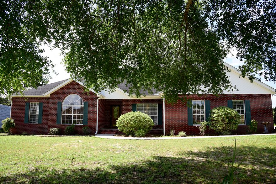 This all brick lakefront home also has a NEW ROOF and a tankless Rinnai water heater! The beautiful kitchen has lots of wood cabinetry, a dual fuel gas range with electric double ovens and center island. Enjoy the great room featuring a vaulted ceiling and a wood burning fireplace. The master suite has a large walk-in closet and adjoining bath with separate shower. Imagine yourself enjoying the heated and cooled Florida room overlooking the private lake.  A handy 16x16 storage shed with double doors is the perfect spot for lawn equipment and pull down stairs in the garage access the attic with decking for extra storage. Don't miss this opportunity to own your own private oasis!