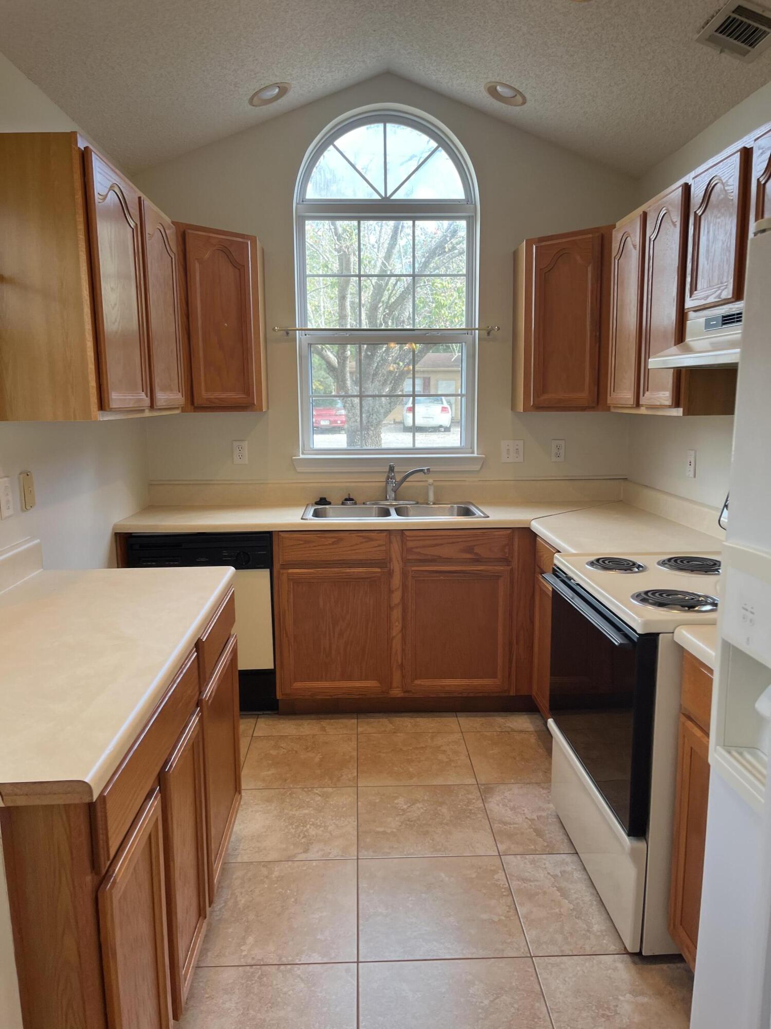 Unique 3 bedroom 2 and a half home in Shalimar. One bedroom downstairs, two bedrooms plus an open living area upstairs. Fenced yard, one car garage. Lawn service included in rent.