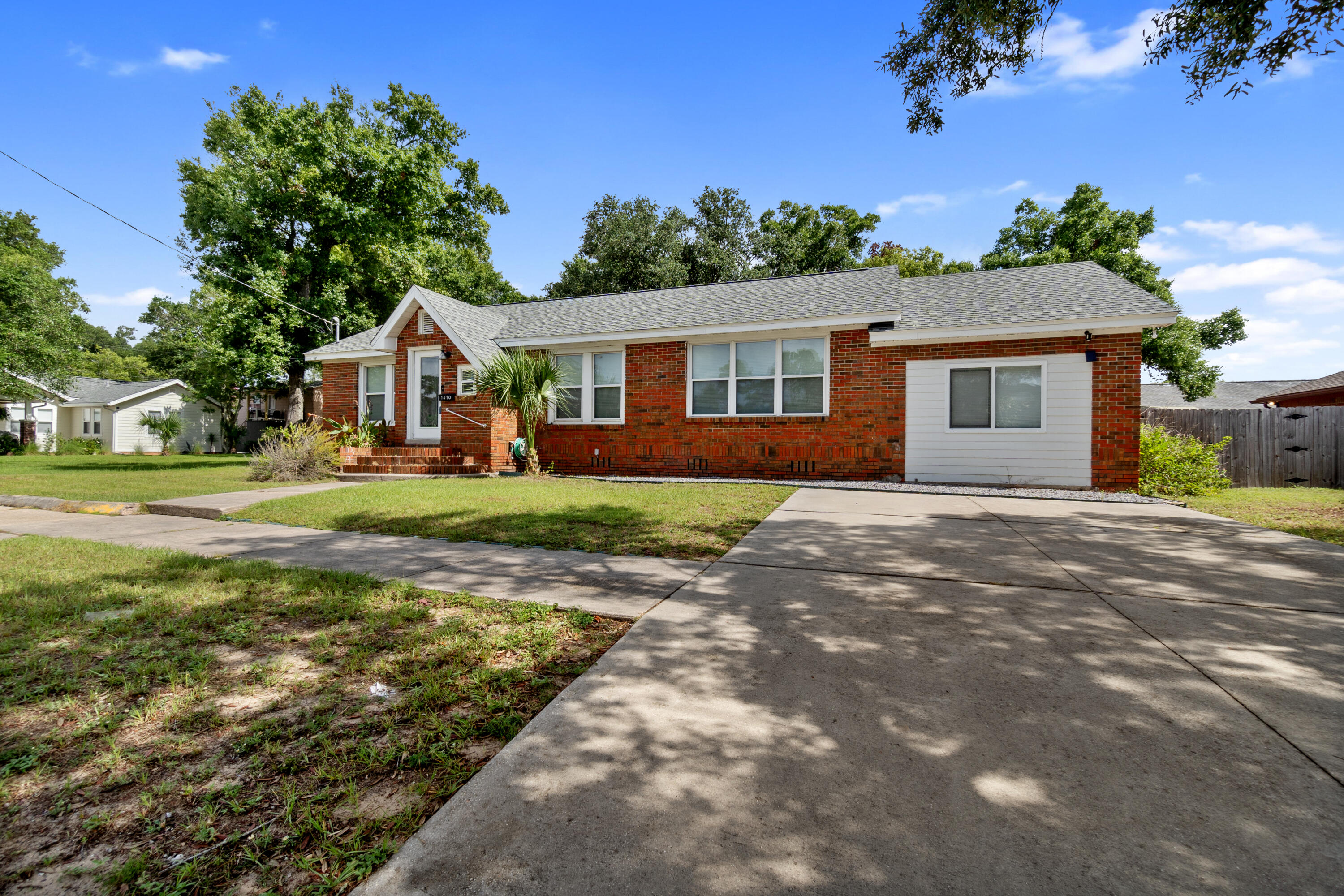 **Affordable Downtown Living in Pensacola!**

Discover the charm of yesteryear combined with modern amenities in this beautifully remodeled downtown home. Nestled on a large lot adorned with majestic oaks, this cottage-style residence offers a perfect blend of comfort and style.

**Key Features:**
- **Spacious and Open Layout:** Step inside to find an inviting, open floor plan with completely redone hardwood floors and freshly painted walls that exude warmth and relaxation.
- **Modern Upgrades:** Enjoy the benefits of all-new vinyl windows and a brand-new dimensional roof, ensuring durability and energy efficiency.
- **Gourmet Kitchen:** The kitchen is a chef's dream, featuring clean white cabinets, granite countertops, and stainless steel appliances that inspire culinary creativity.
- **Luxurious Master Suite:** The converted garage now serves as a spacious master suite with a huge master bathroom, complete with a walk-in shower.
- **Split Floor Plan:** Guest bedrooms are thoughtfully placed on the left side of the home, offering privacy and convenience with their own bathroom.
- **Prime Location:** Situated directly across from the public library and Legion Field, there's always something for you and your family to enjoy just steps away.

This home is a must-see for anyone seeking affordable downtown living with all the modern touches. Buyer to verify all dimensions and school districts.

Don't miss out on this gem - schedule your viewing today!