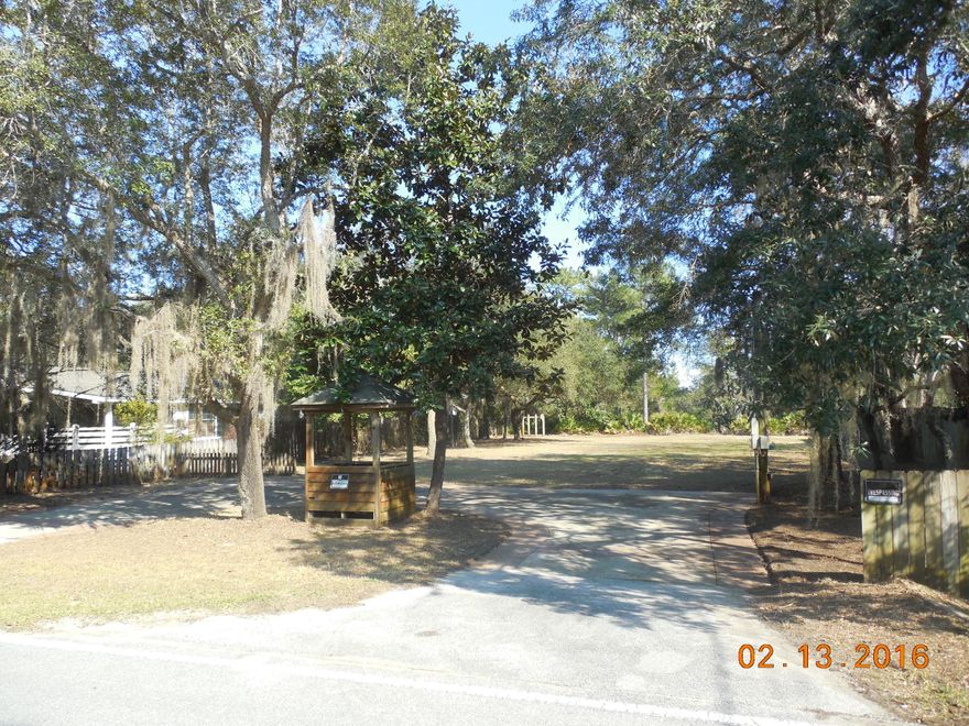 This lot has been cleared and you can really see how nice it looks with Magnolias and Live Oaks and driveway already in place. It is located close to Sacred Heart Hospital and Grande Boulevard. Lot will accommodate a large one story home and is very close to bay with views of water from the back of the property. Public Water & Sewer available Utilities easily accessible