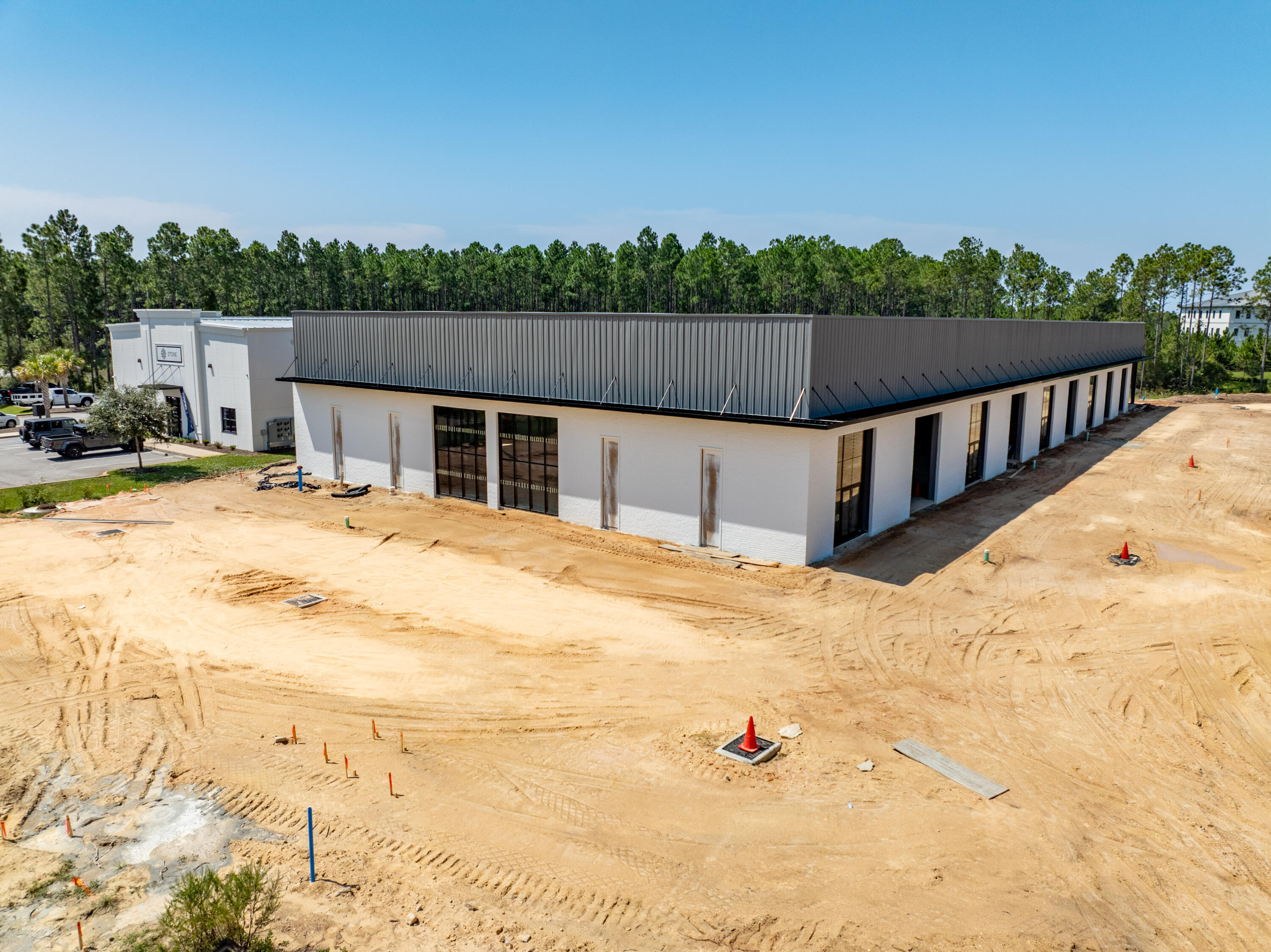 25,430 square foot freestanding building (aka 'Building A') with 20,230 square feet currently available with loading dock under construction (due for completion in November 2025) in South Walton Commerce Park of the Santa Rosa Beach, Florida market. Please inquire for further details. The site plan is uploaded to this listing. This subject new development project involves Walton County, Florida parcels: 05-3S-18-16010-000-0050 AND 05-3S-18-16010-000-0060
