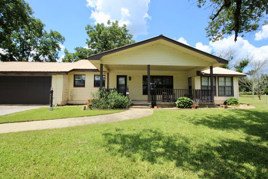 Darling little farmhouse in the perfect farmhouse setting, surrounded by farmland and only 6 miles north of DeFuniak Springs. This block home (covered in vinyl siding) offers 2 bedrooms, 2 full baths and a sunroom that has potential to convert to a 3rd bedroom. It sits almost 200' off the road in a beautiful setting with mature landscaping, large covered front porch, trees for shade - plus plenty of room for a garden in the cleared, sunny area. Farmland views on 3 sides with another farm across the road! There is a 2 car + 1 car garage, both attached for a total of 3 spaces. Plus 2 small portable outbuildings for storage. In good condition, functional layout and good size rooms. There is so much potential - a few updates and this will be a real showplace.