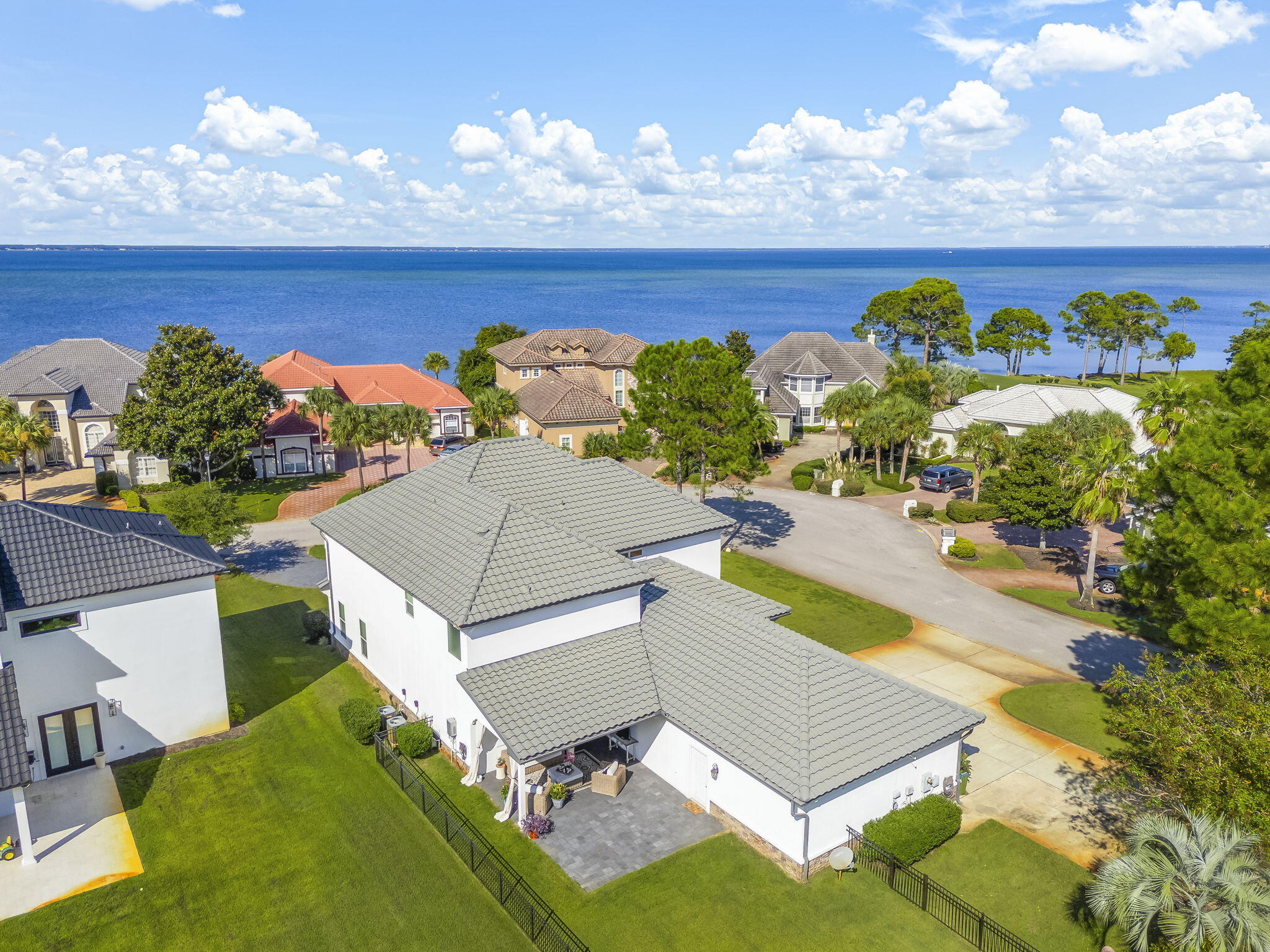 Welcome to this beautifully remodeled and redecorated two-story home that perfectly blends elegance, comfort, and coastal charm. From the moment you step into the grand foyer with soaring 20-foot ceilings, you'll be greeted by light-filled spaces, refined details, and a warm, inviting atmosphere.This home features two fireplaces, extensive shiplap throughout, with crown molding, new ceiling fans, new LED lighting, and elegant chandeliers that elevate each room. The interior and exterior have been freshly painted, new tile in various rooms, a stylish kitchen backsplash, oversized island and a remodeled guest bathroom. A custom-built book nook adds a unique touch of character and charm, overlooking views of the bay.The kitchen is an entertainer's dream with a wet bar, wine fridge, and open sightlines to the spacious living areas. Downstairs, two bedrooms, a huge flex space and a separate family room provide endless possibilities for work, play, or relaxation. Plantation shutters add timeless elegance, while spray foam insulation ensures low energy bills. An AquaPro water filtration system provides refreshing clean water throughout the entire house, even into the built-for-two shower in the primary bedroom.
Step outside to a covered back patio perfect for gatherings and quiet evenings alike, with a paver extension perfect for a fire pit or dining area with grill. The three-car garage features built-ins for ample storage and organization.
Located in a desirable golf course community with access to a pool, tennis courts, and resort-style amenities, this home is both elegant and cozy, spacious yet inviting, a perfect place to create lasting memories. Minutes from the beach and Destin Commons. Enjoy the freedom of a vacation lifestyle, with all the comforts of daily living.