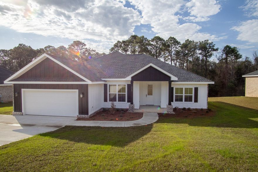 This newly built 4-bedroom, 2.5-bath home features a brick and Hardie exterior with an open floor plan designed for comfortable living and entertaining. Situated on a large lot at the south end of Crestview, the home is convenient location for access to Hwy 85, I-10, Crestview Commons, shopping, dining, schools, and medical facilities. The property borders land recently acquired by Okaloosa County, which has proposed plans for a public park. Some photos may reflect similar homes built by the same builder for reference.