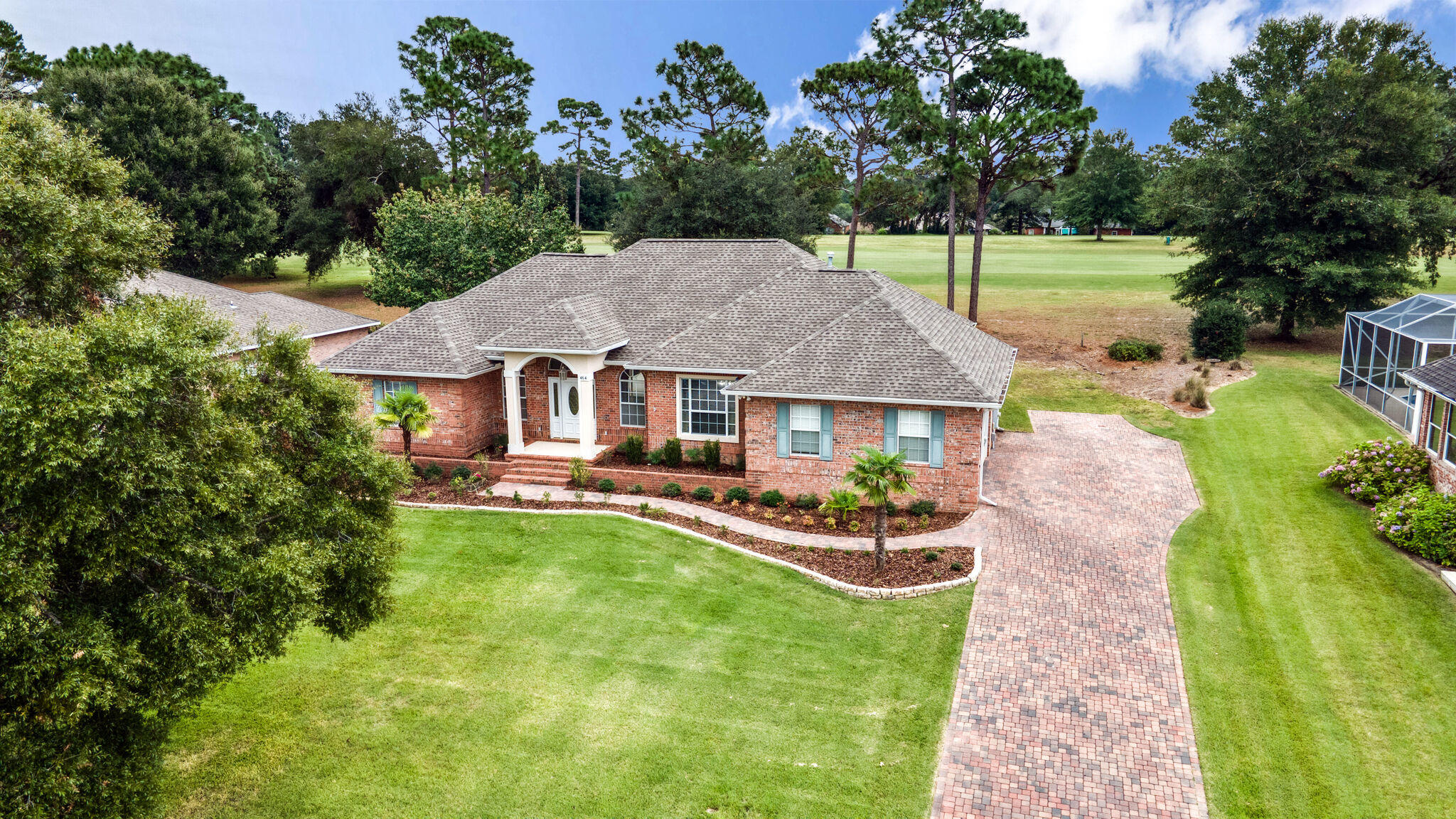 GOLF LOVERS! Experience quality Florida living in Rocky Bayou Country Club Estates, Niceville, Florida. This beautiful split floor plan adjoins the desirable Rocky Bayou Golf Course through its backyard property line. The great room is enhanced by a gas fireplace, built-in bookcases, raised ceiling and wall to wall glass sliding doors allowing plenty natural light and great views to the pool and the soothing golf course. Some of the amenities found in the kitchen are: new glass mosaic backsplash in 2020, granite countertops, gas stove, updated appliances, breakfast bar, breakfast nook, and 2 large windows overlooking the relaxing screened pool. Direct access to the pool from 2 of the bedrooms. Master bathroom features 2