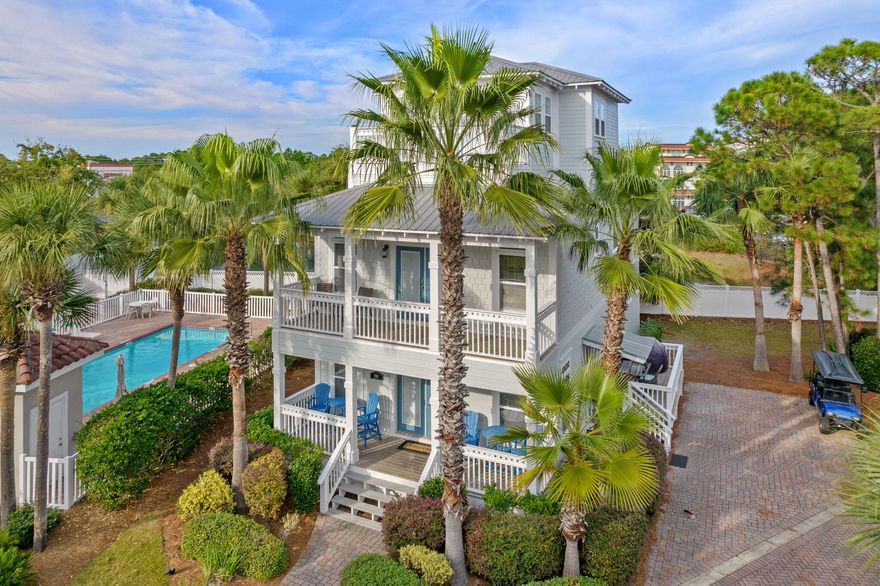 Rare investment opportunity! Deeded beach access.  Extra large lot with room to build a garage, carriage house, etc.  5BR-4BA Newly painted exterior and interior cabinetry.  New LTV flooring throughout. The property is managed on the Beach Blue rental program and is projected to generate $115K-$120K this year. This custom-built home in the gated community of Emerald Waters Village is located right next door to one of the two community swimming pools, and two blocks from deeded beach access. The home is being sold fully furnished and includes a street legal 6-seat golf cart. Quiet cul-de-sac location on an oversized lot with a paver driveway. The living/dining area is perfect for family gatherings and opens to a breezy front porch and side deck. The kitchen offers stainless appliances and custom cabinetry, and there is an additional family room with a kitchenette conveniently located on the 3rd floor