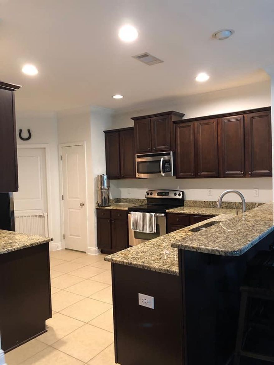 Awesome 3 bed / 2 bath with split bedroom plan near the community pool & backs to preservation! Owner has upgraded this 6 year old home w crown molding in the trayed ceiling in the living room, enclosed the patio to provide more family space & used designer paint scheme! Kitchen is a delight w granite counters & lovely dcor. Little touches make the home simply awesome, such as a pantry light comes on when opening the door, 2 inch blinds thruout, new bedrm floors, privacy fenced yd w 3 gates, & lawn pump / sprinkler system to keep your lawn in tip top shape! This is a highly sought after Mesa floor plan w a 2 car garage & flex rm, depending on your needs! Come see this floor plan, the back to nature location, & only the 10th house fm the community pool! Call for your appt, today! Cheers!