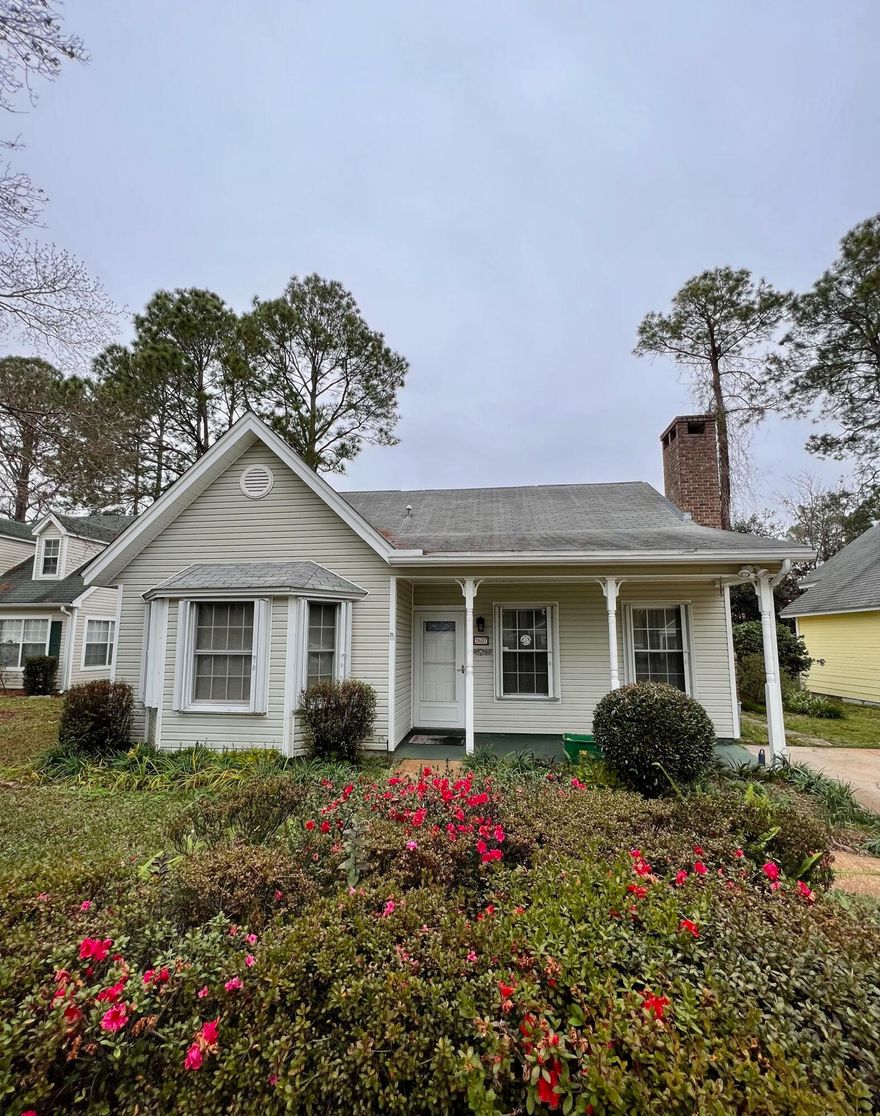 Adorbable 4 bedroom, 2 bath, one owner cottage home nestled in central Fort Walton Beach.Featuring great curb appeal with landscaped flower beds, and a covered front porch- perfect for rocking chairs and sipping sweet tea. As you enter the home you'll be greeted with a spacious living room with a cozy wood burning fireplace. Kitchen with breakfast nook, and an abundance of countertop space, and white cabinetry. Just off the breakfast nook through glassed french doors is a wonderful Florida room, overlooking the fenced backyard.Main level primary bedroom with delightful bay window, walk in closet, and en-suite walk-through bathroom with tile flooring and beautiful cultured marble shower. One additional bedroom located on the main level. Upstairs you'll find two spacious bedrooms, and a
