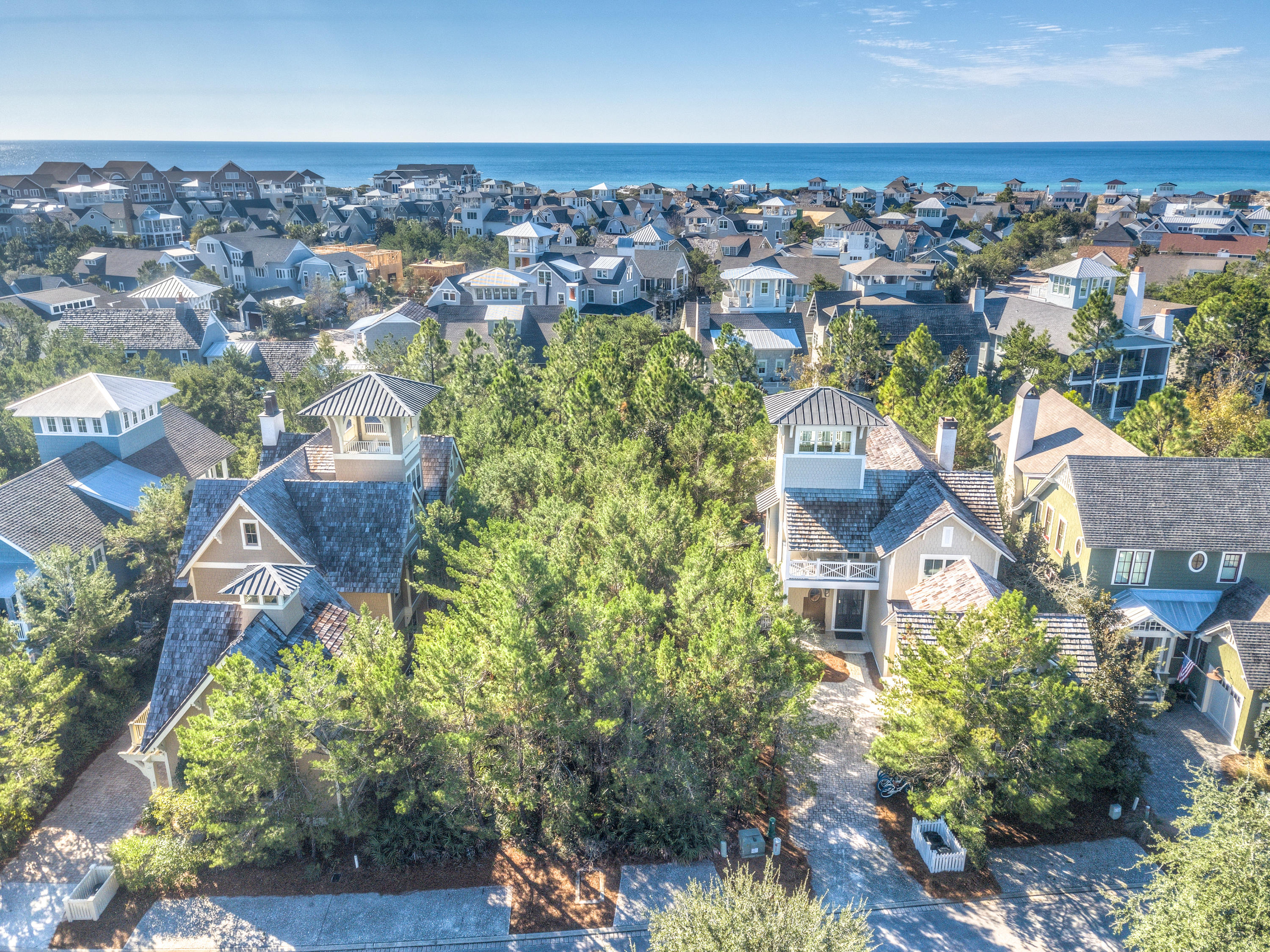 Beautiful large homesite in highly coveted WaterSound Beach being sold with approved custom home plans by Harrison Design out of Atlanta, Georgia. This amazing homesite backs up to a nature area with natural vegetation and a babbling brook making for a peaceful and serene setting. Soak in views of the graceful footbridge to the east and the charming vehicle bridge to the west and spectacular gulf views from the tower of your home! Enjoy all the amenities of WaterSound, which include the private beach club, beautiful conservation areas with parks and trails shaded by coastal pines and oaks. WaterSound is a sought after community on scenic Highway 30-A, bounded by the Gulf of Mexico to the south, one of the area's gorgeous coastal dune lakes on the east and Deer Lake State Park on the west.