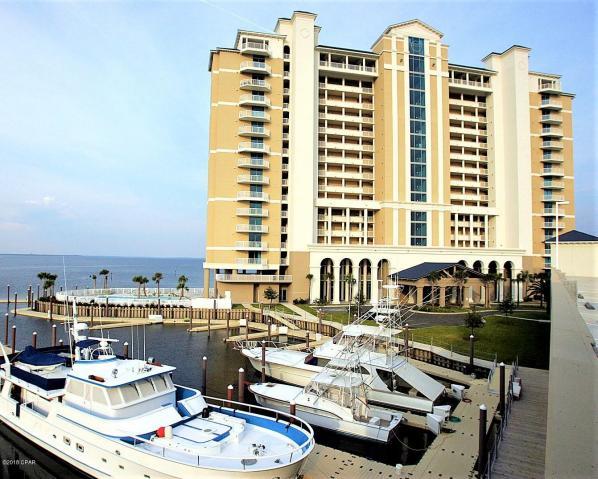 For those with discerning taste and seeking the perfect full time residence or second home, Marina Landing provides every thing you've ever dreamed of. Marina Landing features floor to ceiling views of the pristine St. Andrews Bay from every room and the expansive balcony features a stainless outdoor kitchen that provides you with a true outdoor living space that is perfect for entertaining family and friends. The Chef Designed Kitchen offers an abundance of cabinetry, granite counter tops, breakfast bar, stainless steel appliances and full pantry. The Master Bedroom Suite comes with full walk-in closet, luxury master bath with separate shower and extra deep soaking tub great for those bubble baths! This spectacular property has a private deep water marina onsite and is just minutes to the