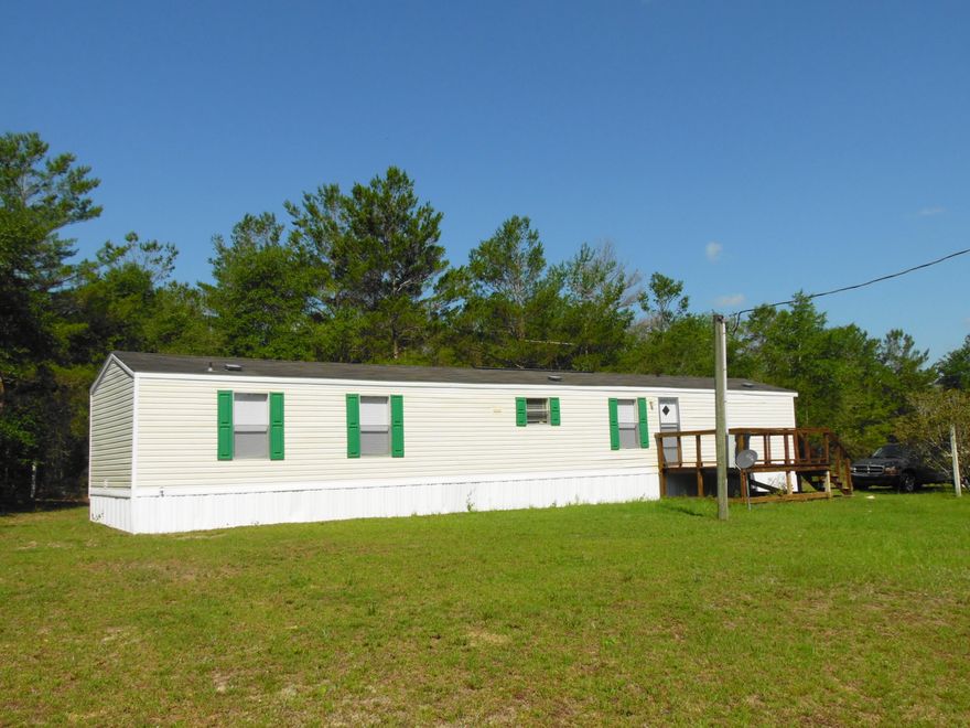 Nice starter size 2005 single wide mobile home with spacious floor plan with 2 bedrooms and 2 baths with center living room/kitchen/dining room combo. Property is located on a corner lot on paved street in front of the property.
Storage building included.