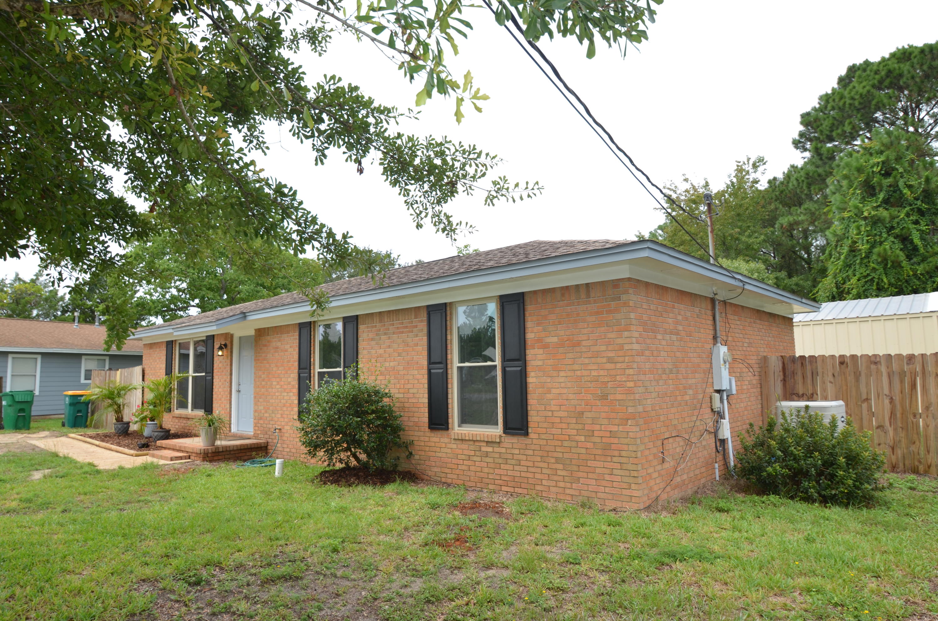 Total renovation done that backs up to vacant wooded land. Renovation included the addition of a spacious shower in the master bathroom so that it's a full 3 bed and 2 bath. All kitchen and bath cabinets are brand new with granite countertops. Newer windows along with full paint and flooring. Plenty of parking room in the front of the house with double gates opening to the back yard. Super metal workshop with metal roof (with insulation) 21 x 24 .