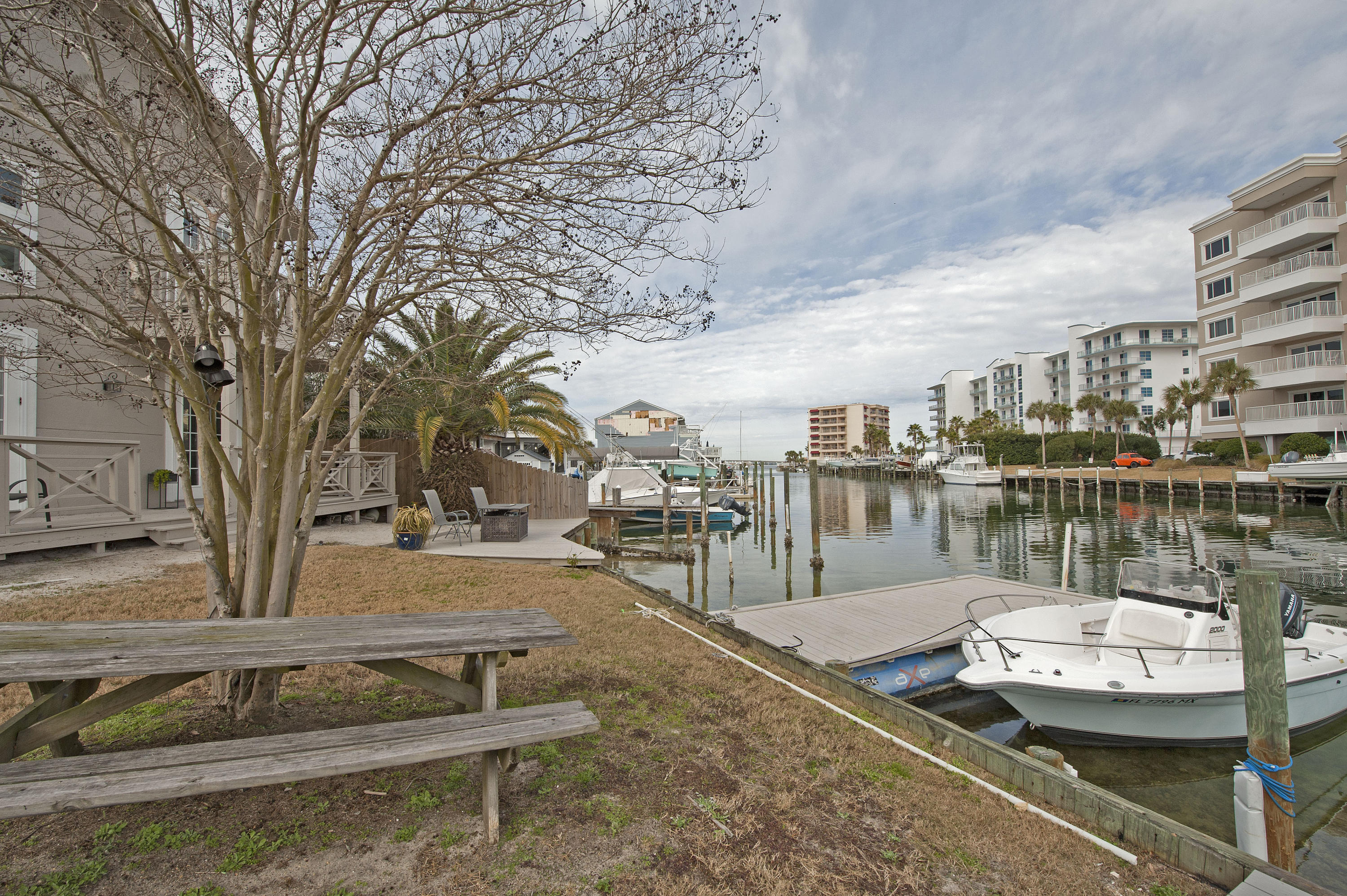 Check out this lovely townhome in the heart of Destin. Own 3 bedrooms 3 bath water living for under $300k. Your Master Suite, Living Room, Kitchen, Dining Room & Laundry are all on the 1st floor. Enjoy an updated kitchen with granite counter tops & a double pantry. Your sunlit living room features laminate wood floors, gas fireplace, french door opening to exterior deck w/ yard building and access to the water. Take your Kayak out or park your boat in the Durango Winds Boat slip! The Master suite includes an upgraded bathroom with tile shower, double vanity & nice size walk in closet. Your 2nd floor includes 2 spacious bedrooms connected by a Jack & Jill updated full bathroom with vanity, tub & shower. You will enjoy the extra space in the loft/ bonus room. Use as a study, play area or media room. You can enjoy DESTIN LIVING at its finest or use as a second home & vacation rental. Call for questions or to set up a showing. This property is apart of two (2) Associations- Durango Winds (HOA Dues are $250 per Quarter) and Holiday Island Improvement Association (HOA Dues are $225 per year).