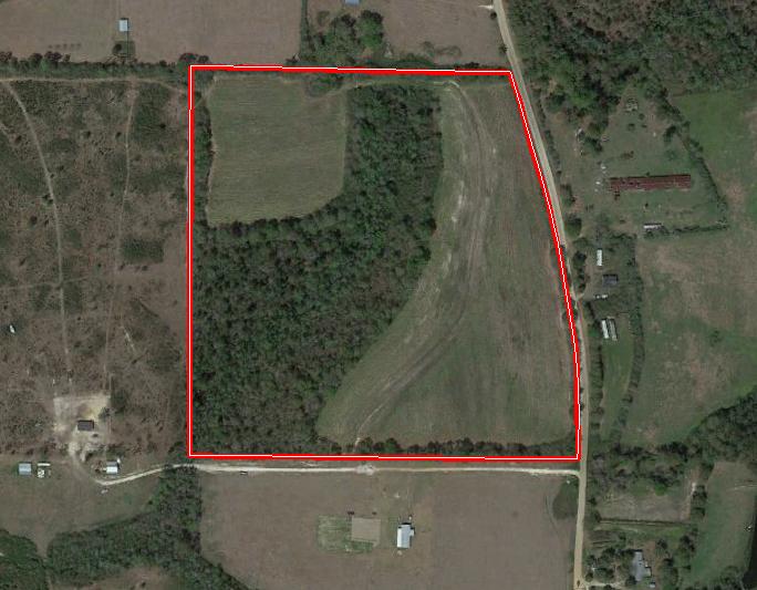 Nice home site. Front of property is being used by tenant to grow crops. Wooded area acres middle of 4 properties.